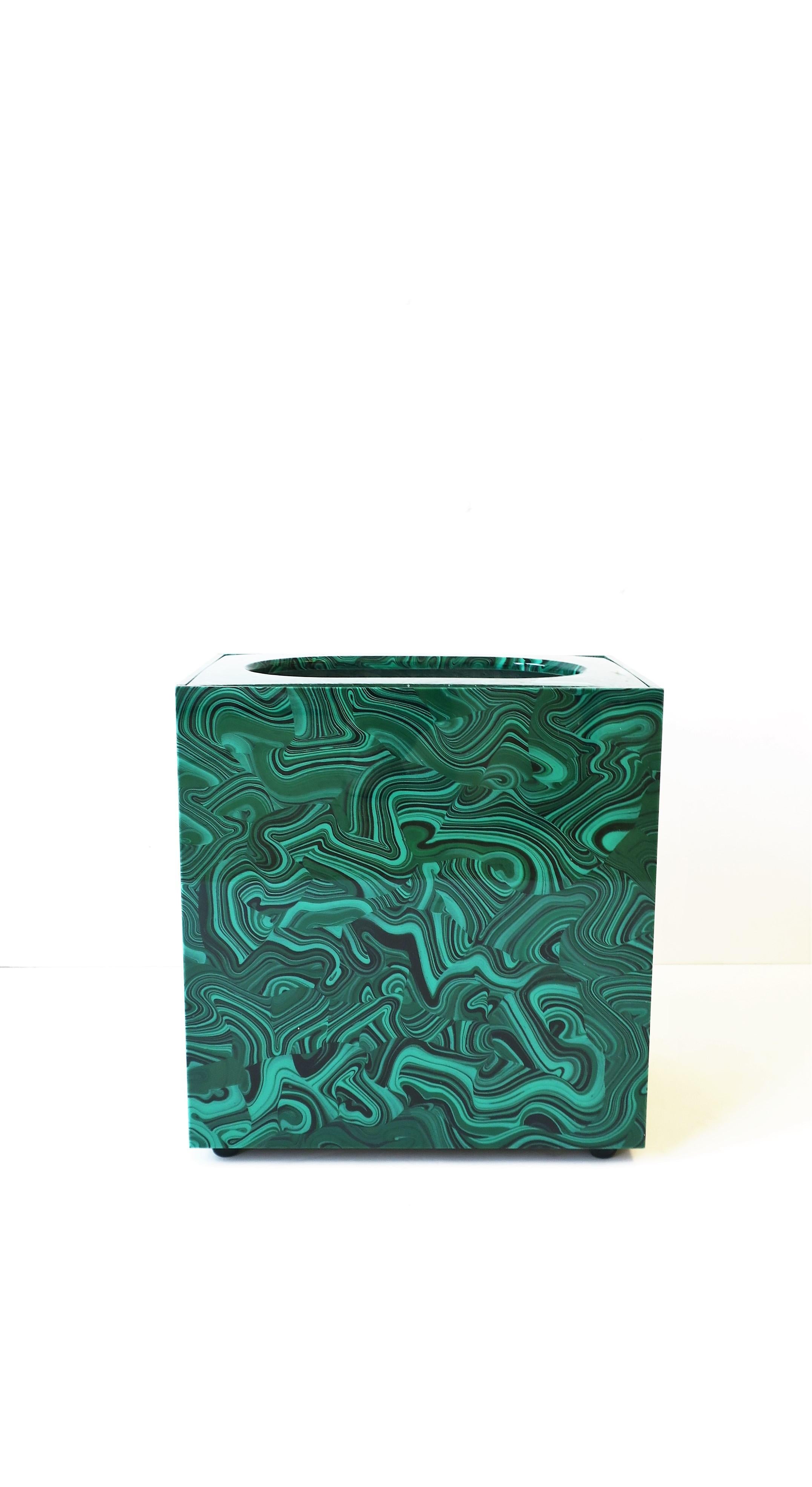 A striking green malachite style resin wastebasket or trash can. Piece is rectangular in shape and convenient for an office, dressing room closet, vanity/bathroom area, etc. Piece measures: 7.13