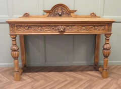 Green Man Carved Golden Oak Hall Table  The table is made in solid Oak
