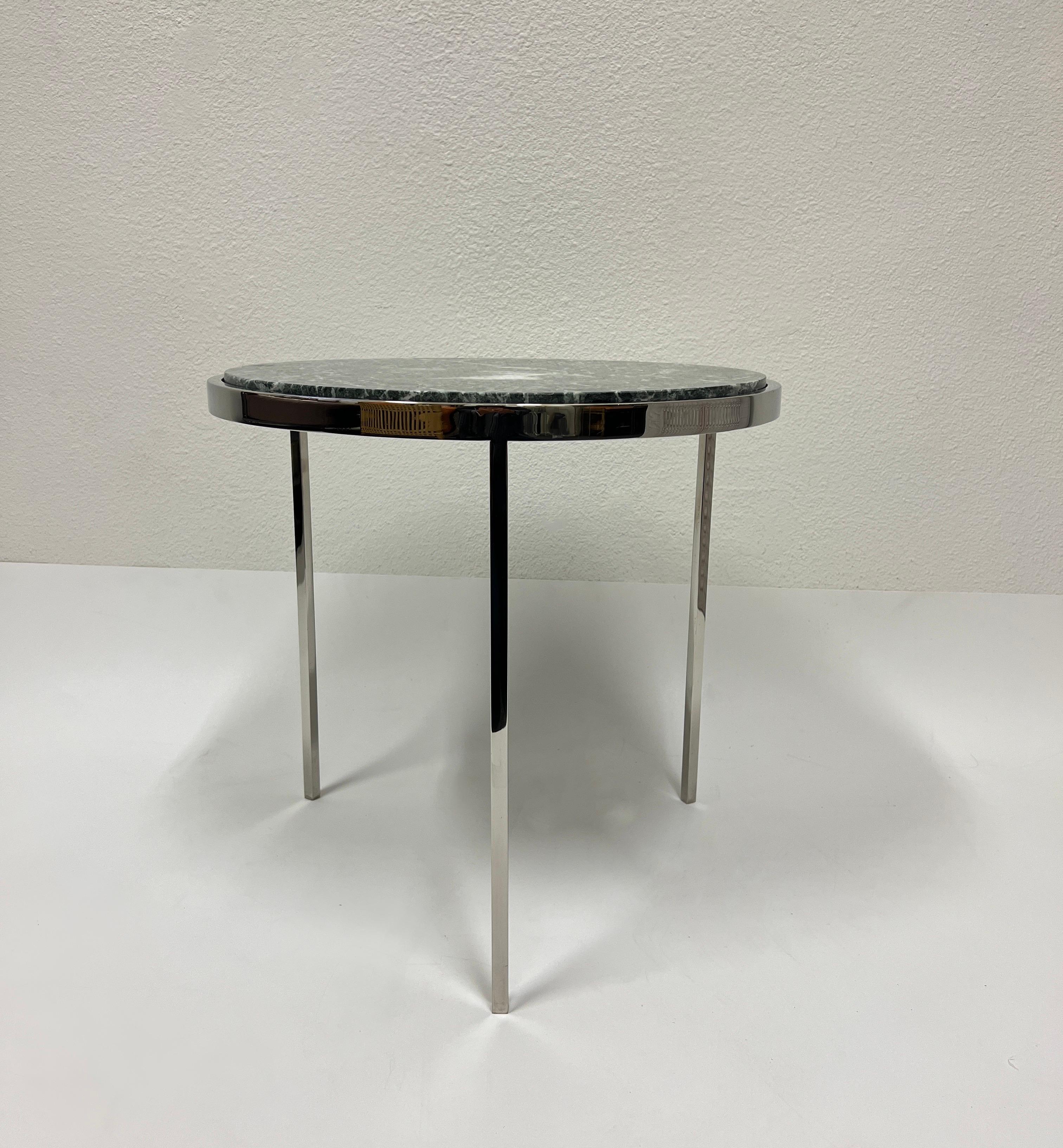 1980’s Round tripod solid polished stainless steel with a green marble top side table by Brueton.
In beautiful original vintage condition.
Measurements: 19.13” Diameter, 18.25” High.