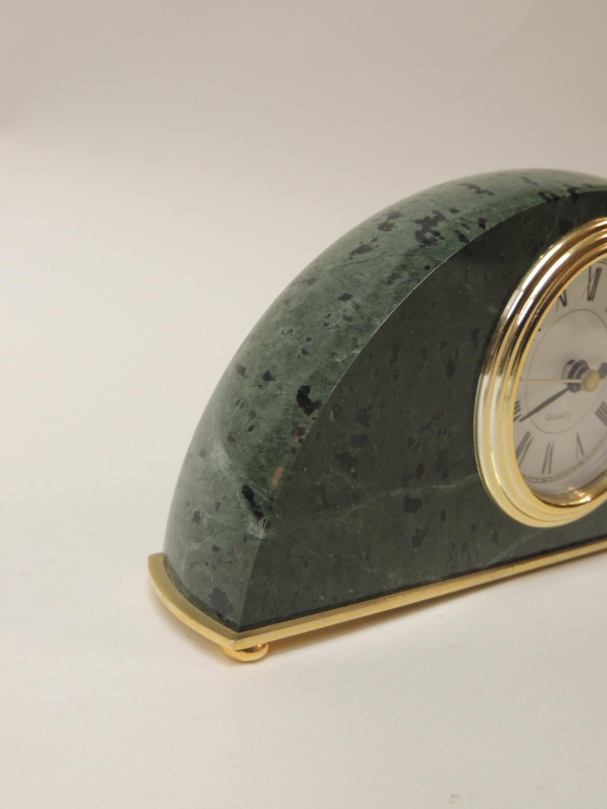 Green marble desk clock. Oval shape desk clock with gold details and fitting.
(Excellent working conditions.)
Taiwan, 2000s
Size: 7 x 1.5 x 4 H.
