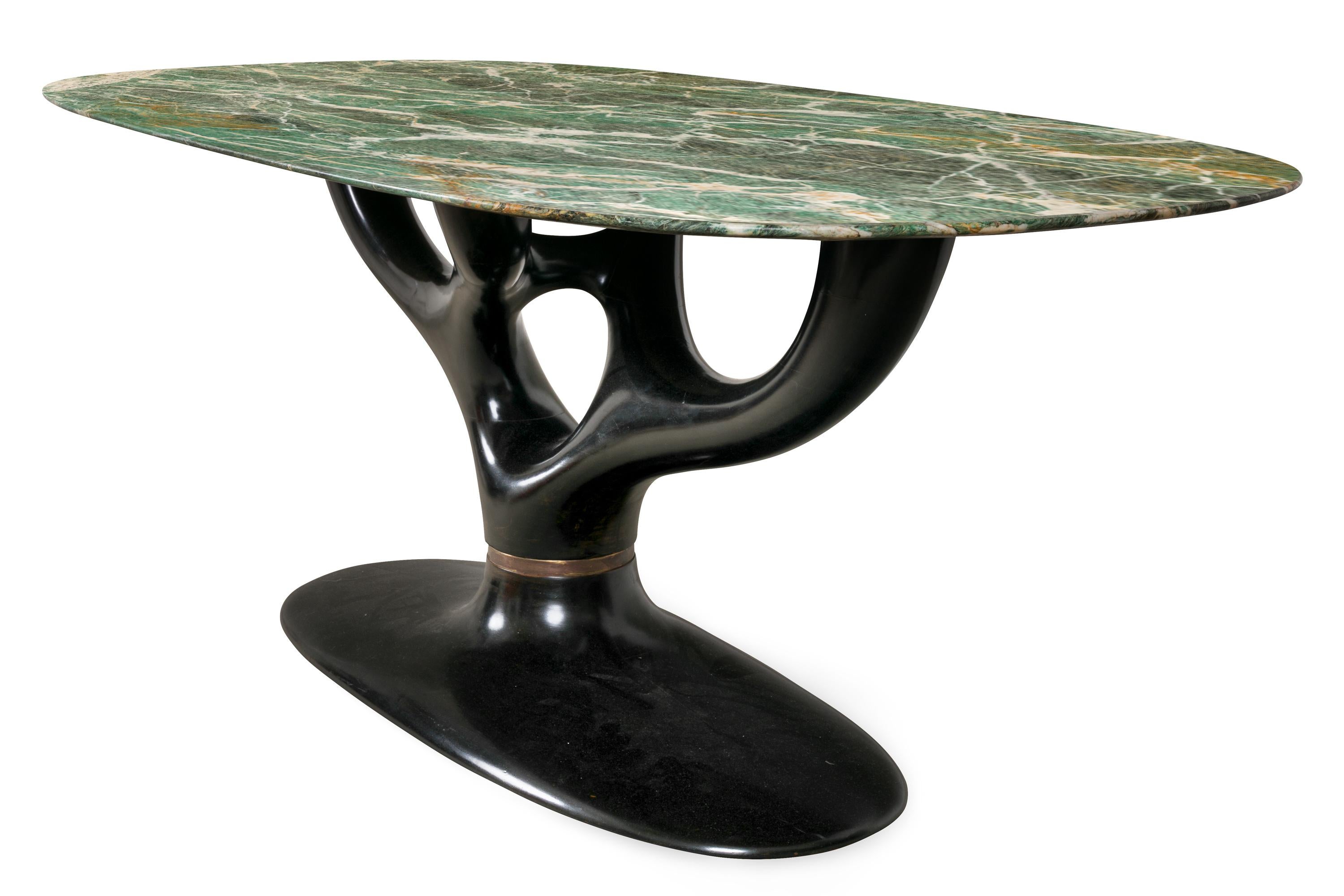 An amazing table with incredibly beautiful Italian marble and a spectacular ebonized organic base.