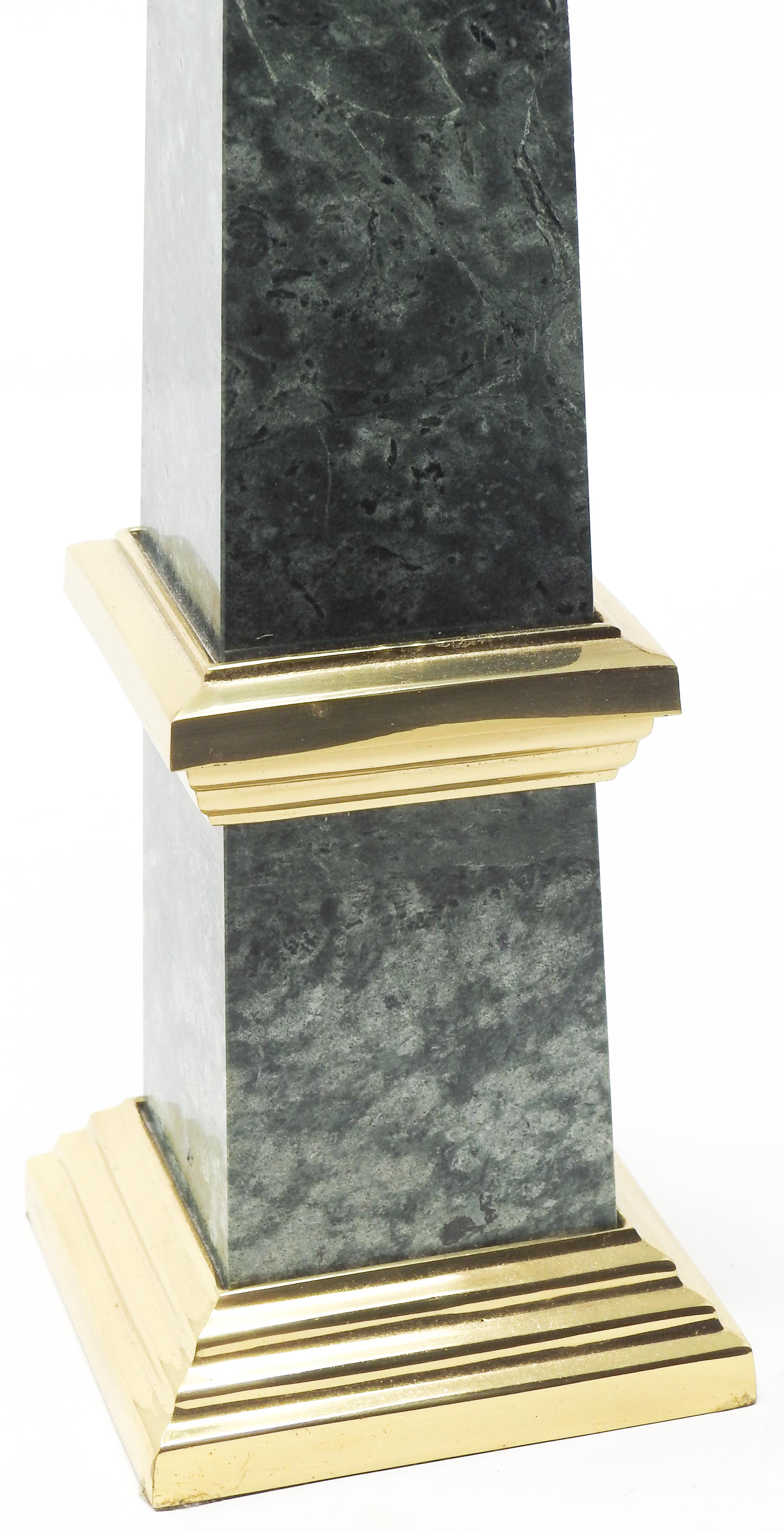 Offering this beautiful green marble obelisk. Starting on a brass base it rises to meet a platform that is also done in brass and then tops out with the green veined marble.