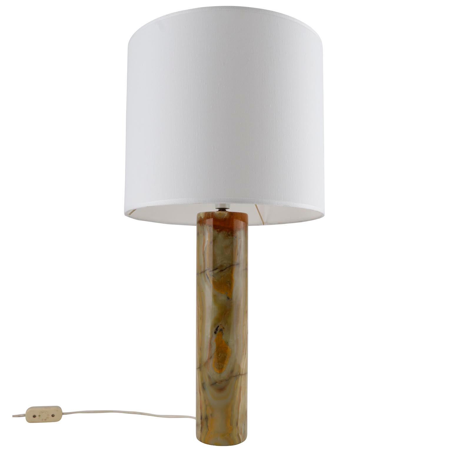 A beautiful table lamp made of green and brown marble made in Italy in 1970s.
The height including lamp shade is 27.5 inch / 70 cm and without lamp shade 18.5 inch / 47 cm.
The natural white lamp shade has been renewed.
Dimensions:
With
