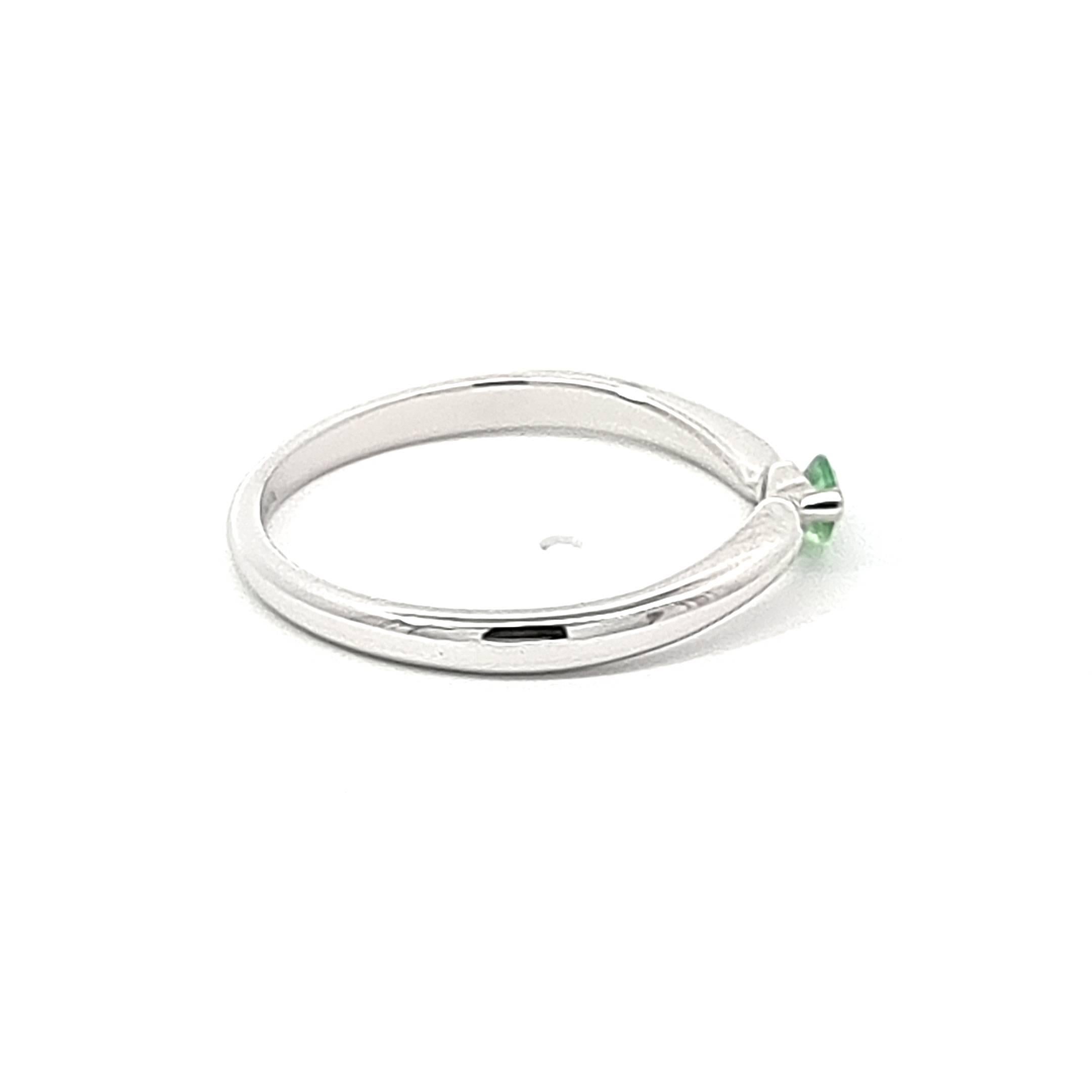 Indulge in the allure of our professionally crafted 14K White Gold Ring, featuring a singular marquise tsavorite garnet, a gemstone that epitomizes understated elegance. The vivid green hue of the tsavorite, weighing 0.22, steals the spotlight,