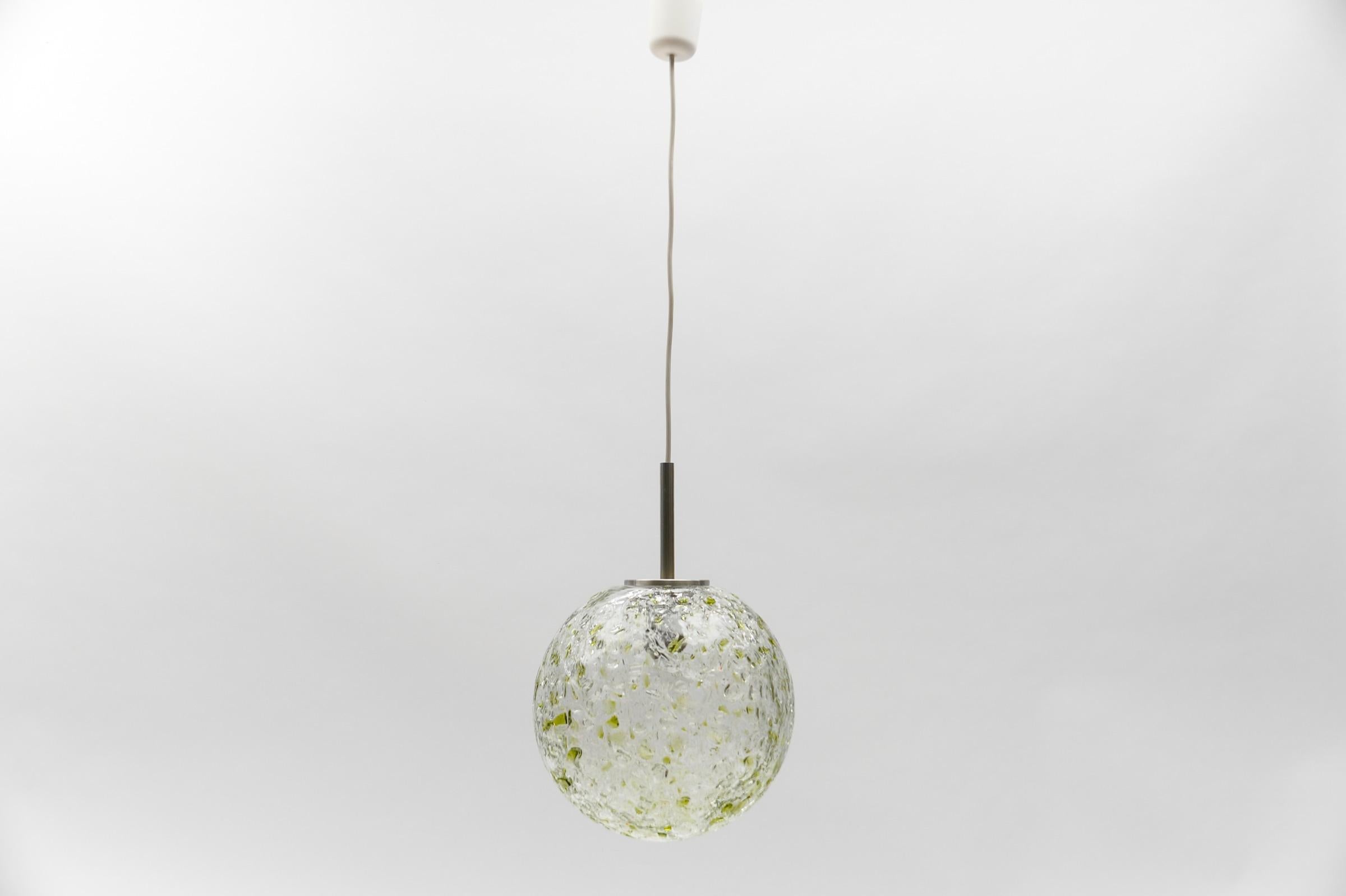 Green Massive Glass Ball Pendant Lamp by Doria, 1960s Germany

Dimensions
Diameter: 11.81 in. (30 cm)
Height: 41.33 in. (105 cm)

One E27 socket. Works with 220V and 110V.

Our lamps are checked, cleaned and are suitable for use in the USA.