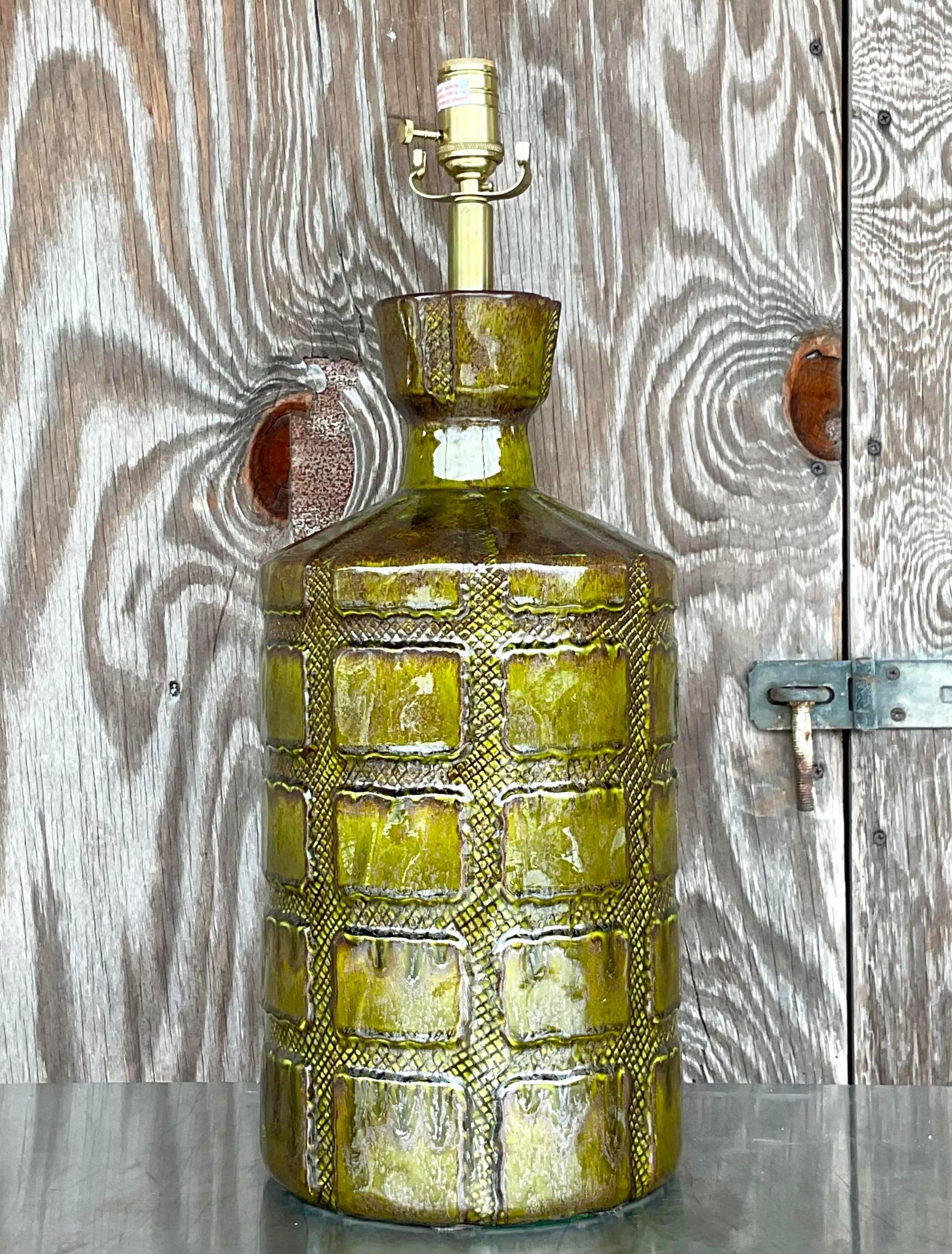 Fabulous vintage MCM table lamp. A chic glazed ceramic finish with a beautiful moss green color. Fully restored with all new hardware and wiring. Acquired from a Palm Beach estate 
