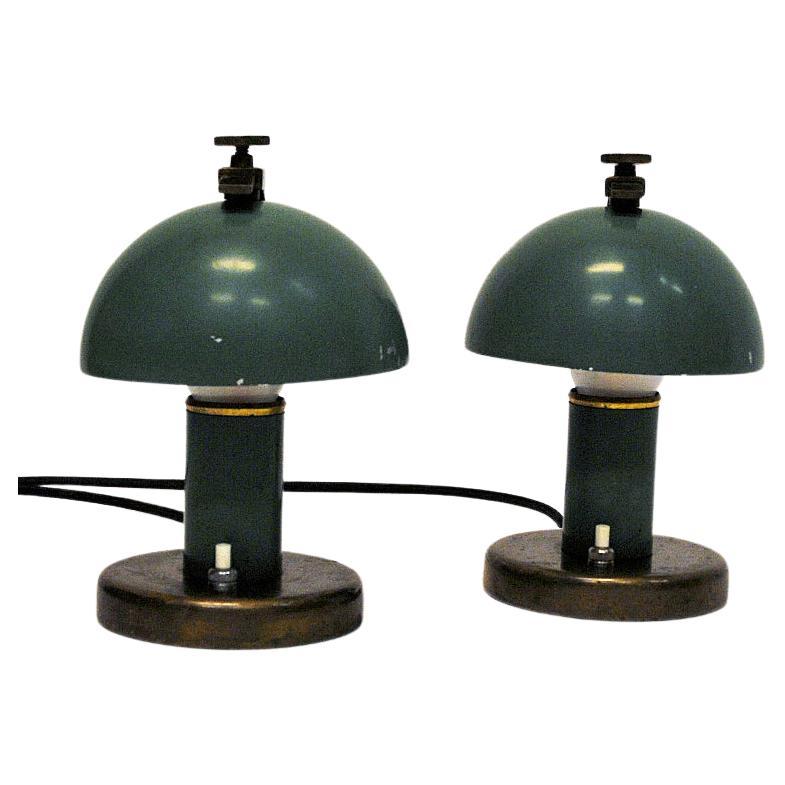 Rare and green vintage metal and brass pair of table/desk lamps designed by Erik Tidlund for Nordiska Kompaniet (NK) in the 1930s - Sweden. Functionalistic and mushroom shaped lamps with new black wiring. The lightswith is located at the bottom.