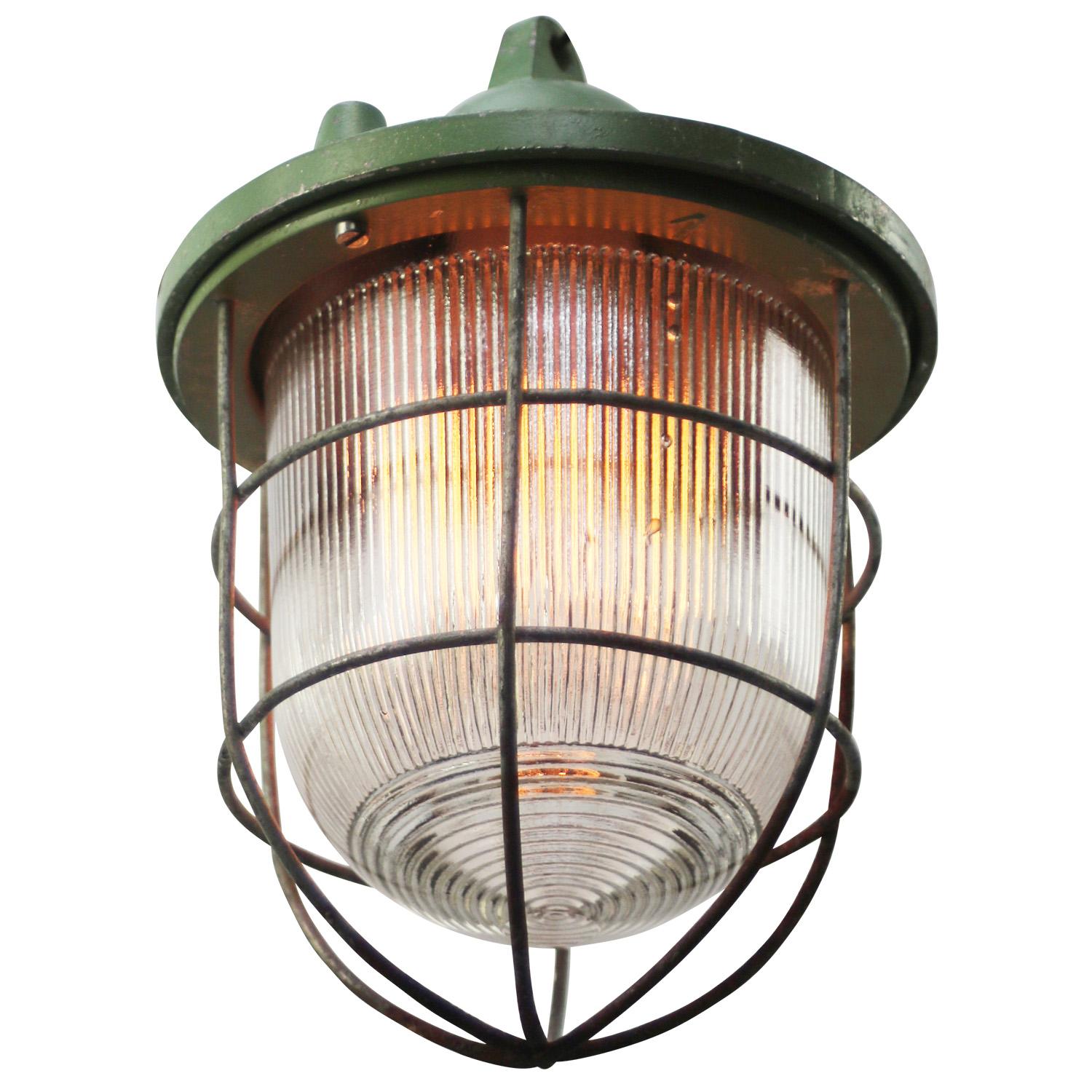 Industrial hanging lamp
clear striped glass
green cast aluminium top

Weight: 2.90 kg / 6.4 lb

Priced per individual item. All lamps have been made suitable by international standards for incandescent light bulbs, energy-efficient and LED bulbs.
