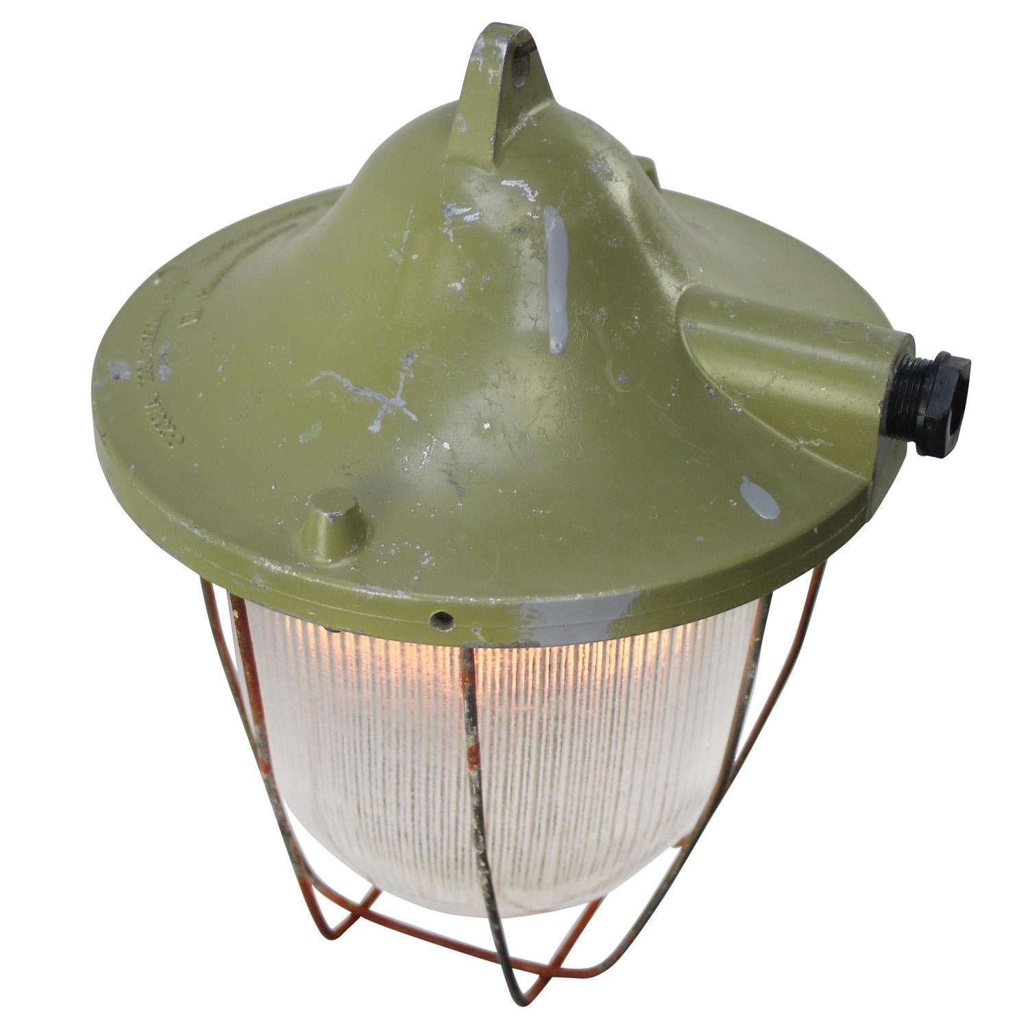 Industrial hanging lamp
clear striped glass
green cast aluminium top

Weight: 2.90 kg / 6.4 lb

Priced per individual item. All lamps have been made suitable by international standards for incandescent light bulbs, energy-efficient and LED bulbs.