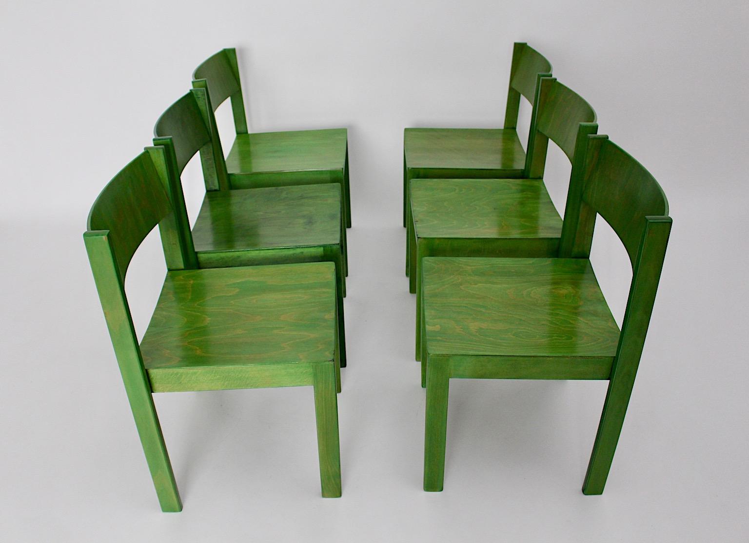 green wooden chairs