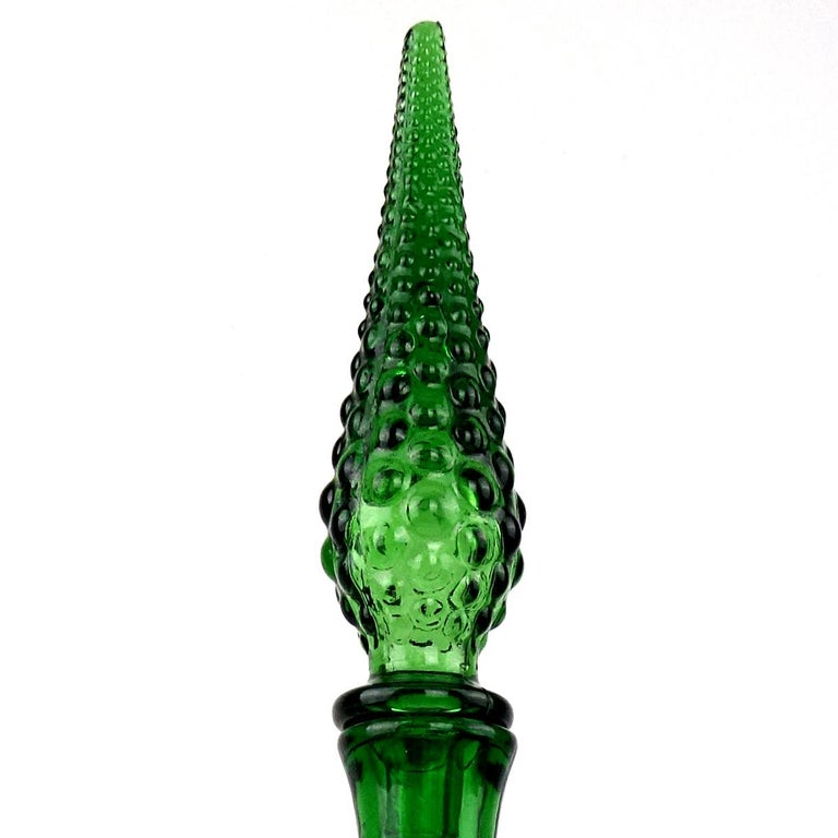 Sleek midcentury green glass decanter with stopper.
The design by Empoli is called genie.
