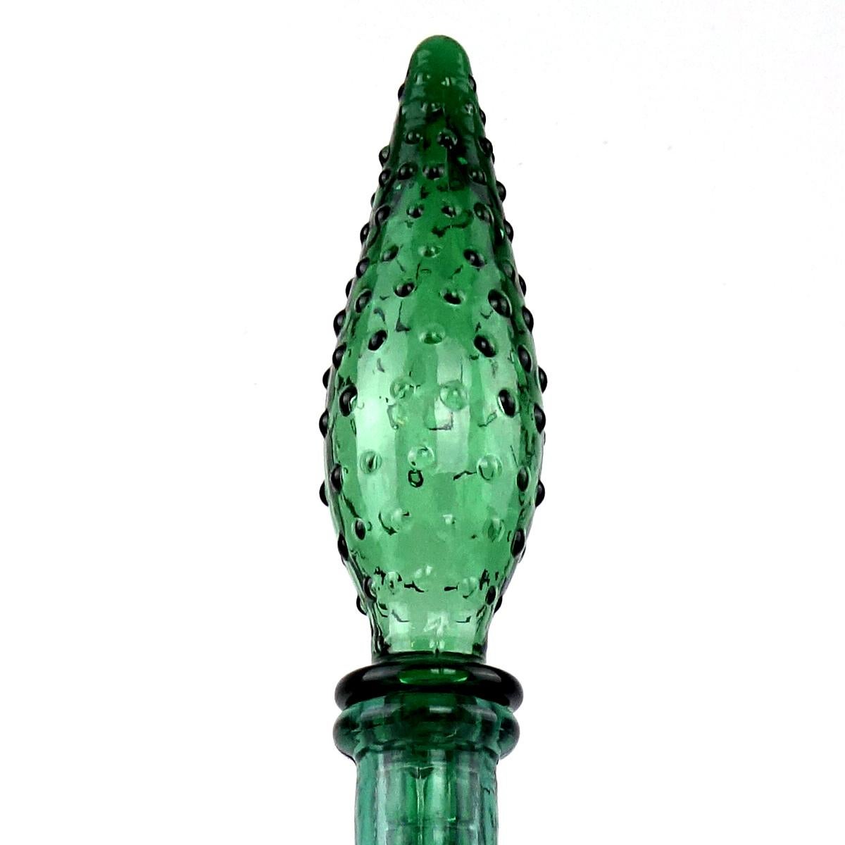 Sleek midcentury green glass decanter with stopper.
The design by Empoli is called Genie.