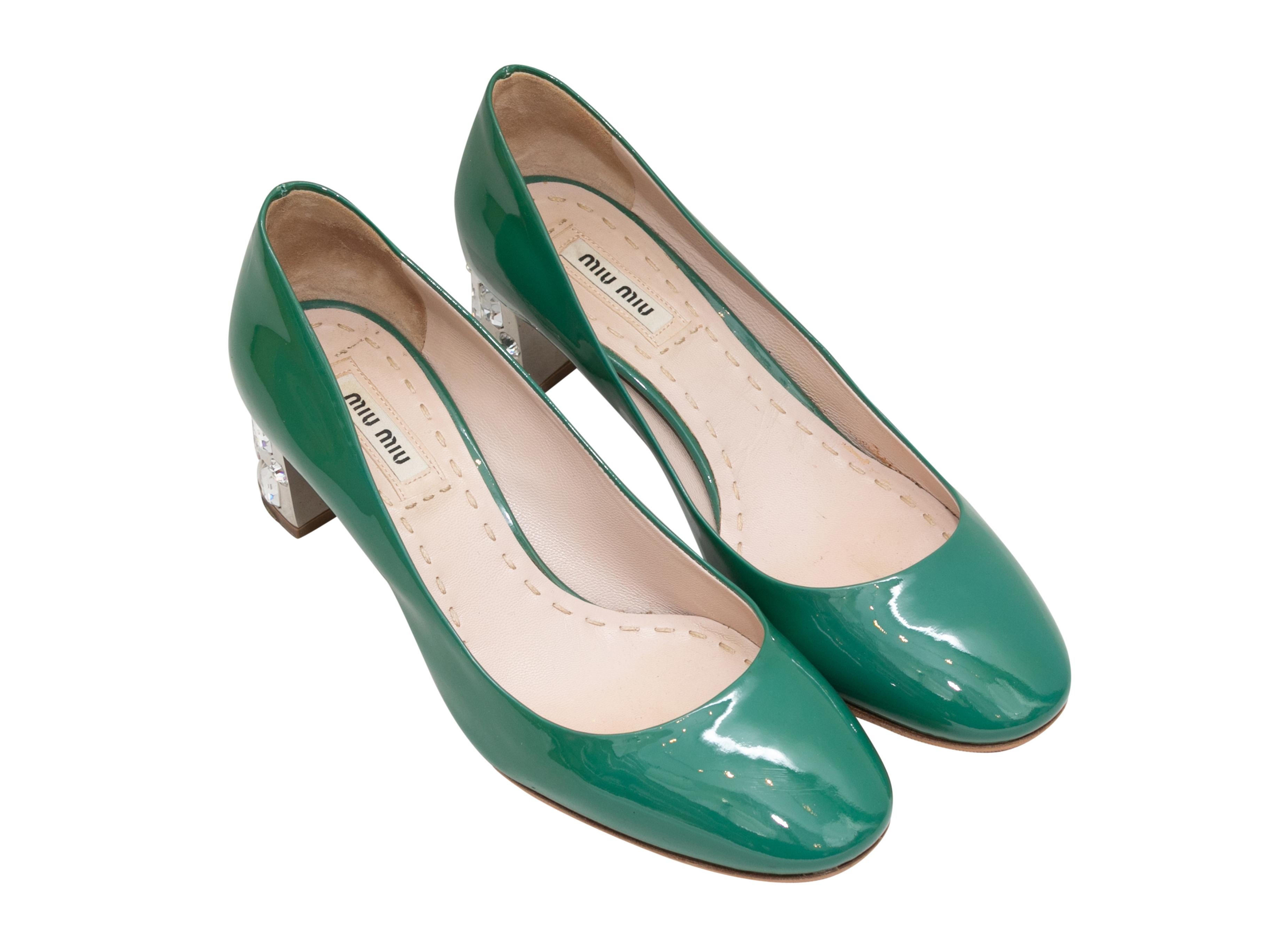 Green patent leather pumps by Miu Miu. Crystal-embellished block heels. 1.75