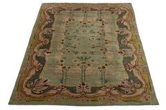 Grüner moderner Donegal-Teppich im Kunsthandwerksstil Handgefertigter Wollteppich