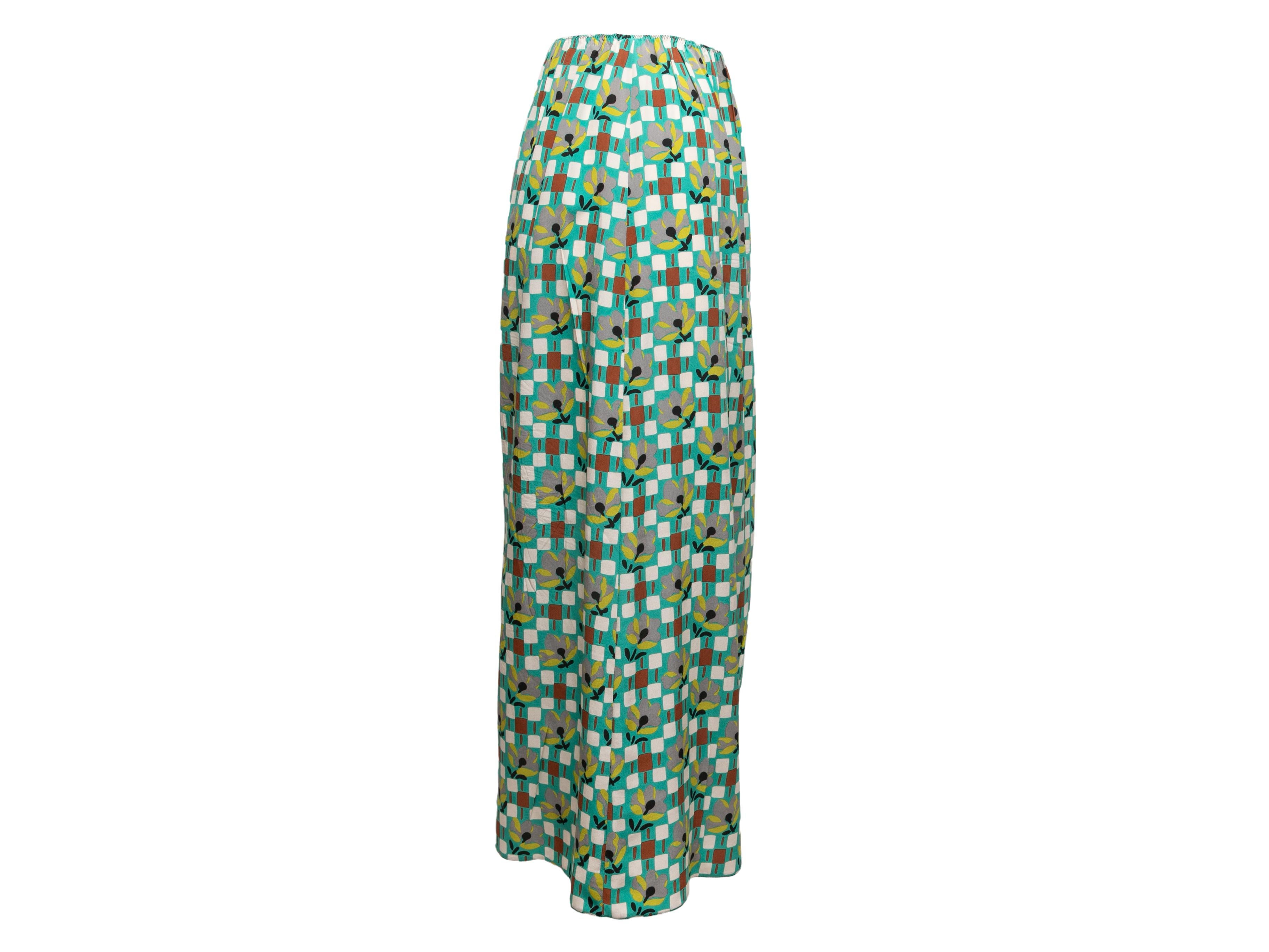 Green and multicolor geometric floral print skirt by Prada. Lace and ruffle trim at front. Elasticized waistband. 24
