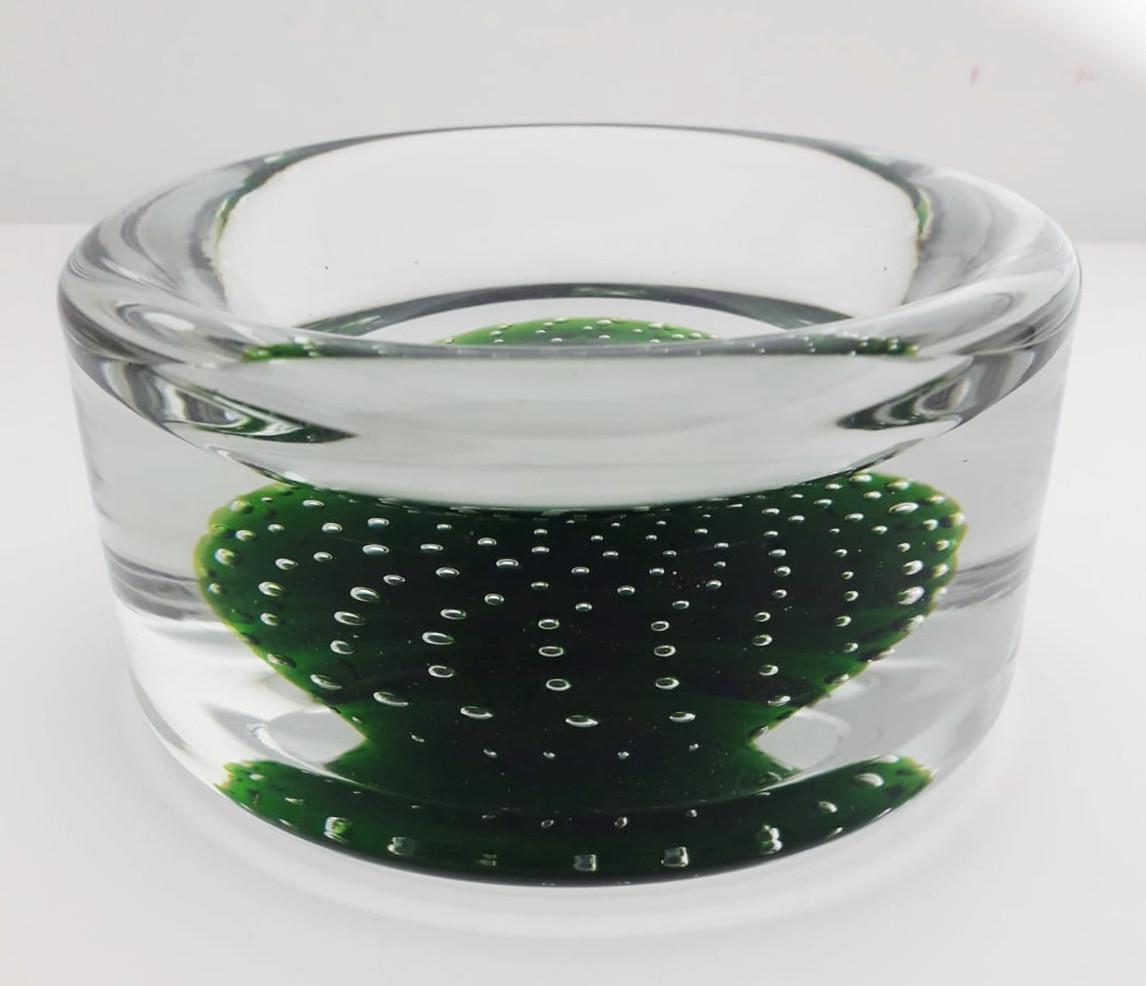 Italian clear and green Murano glass bowl carefully hand blown with bubbles inside the glass using Bollicine technique, made in Italy, circa 1960s
Measures: Height 2.75 inches, diameter 5 inches
1 in stock in Italy currently ON HOLIDAY SALE for $599