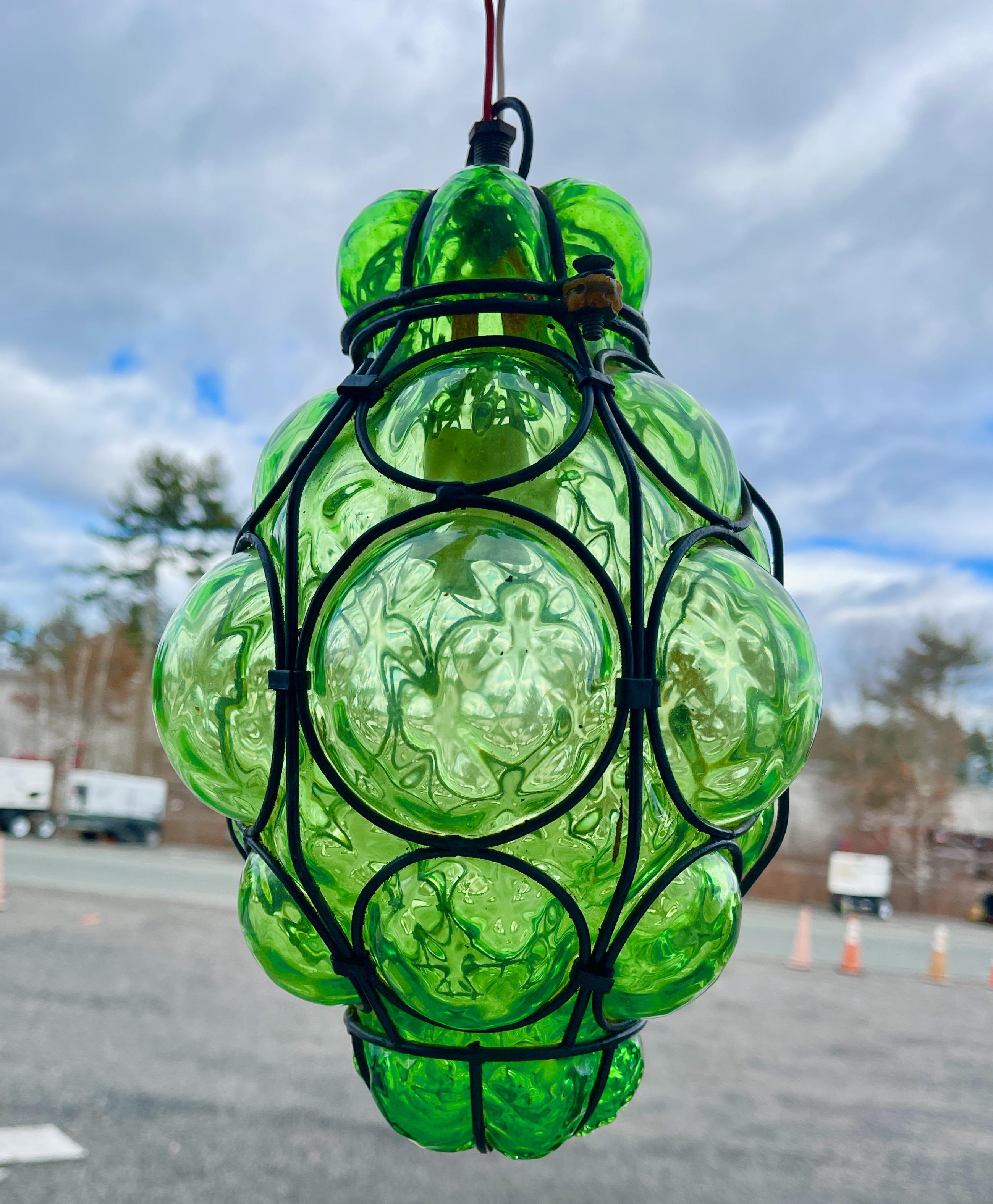Vintage Murano iron caged bubble glass in rare green by Gianni Seguso.   Fixture itself is 11