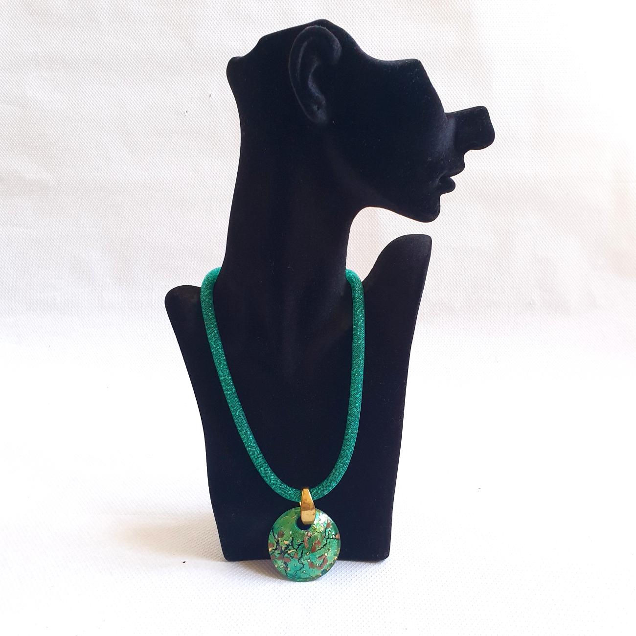 Murano glass pendant costume necklace, Italy.
The Murano glass convex ornement and the brass hook are vintage, circa 1970s. 
The beaded chain and clasp are new.
In a beautiful bright green color, and excellent condition.
