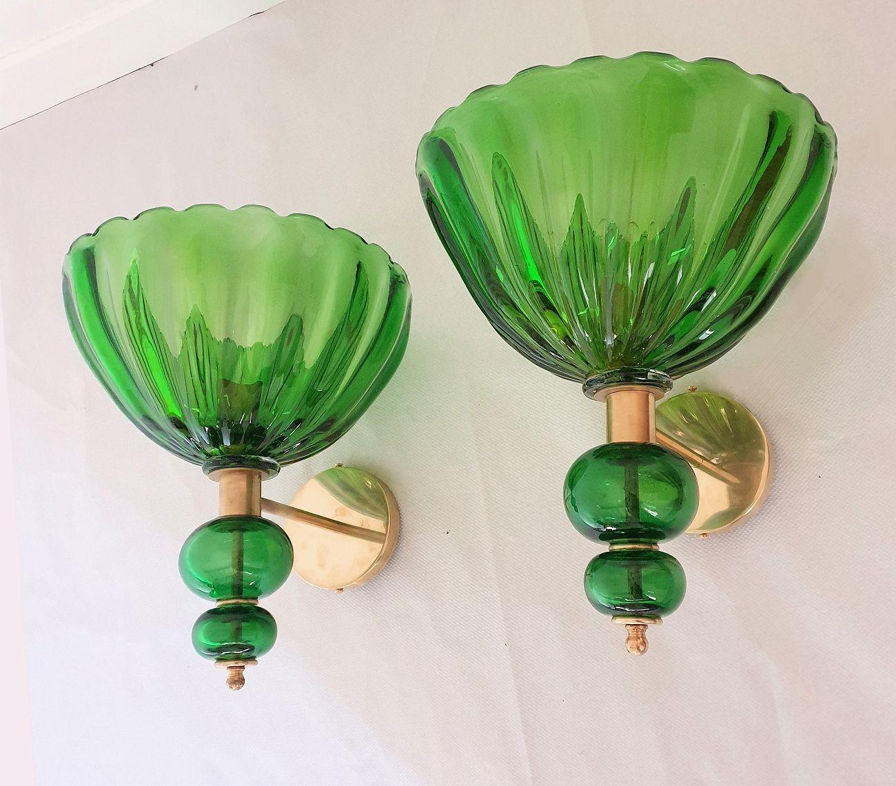 Pair of large Hand-blown Murano glass sconces, attributed to Barovier and Toso, Italy 1980s.
The Murano glass is thick, translucent and in a Medium Green - Bottle Green color.
The sconces mounts are made in brass and gold plated metal.
The diameter