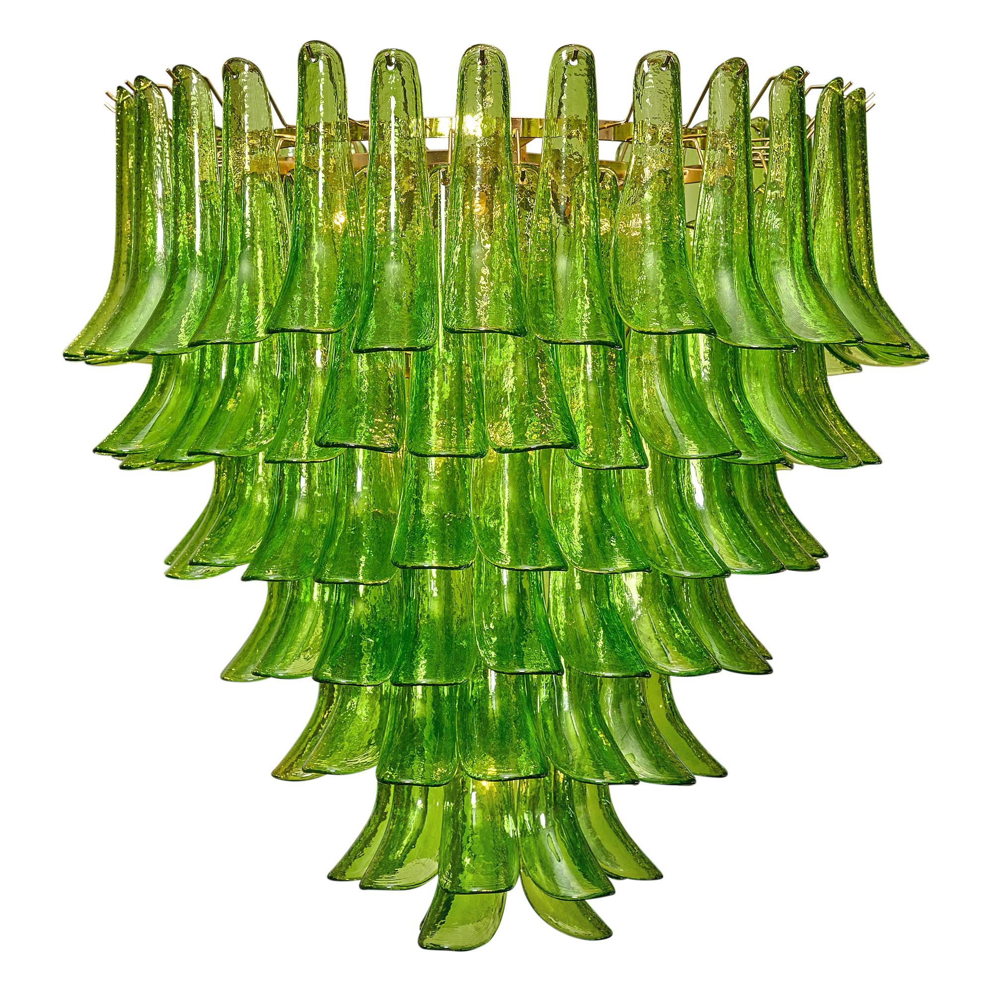Green Murano glass “Selle” chandelier with stunning pieces overlapping to create a feathered effect. This stunning work of art; from the artisans in Murano, Italy, created this piece out of green glass with hand-blown techniques through each piece.
