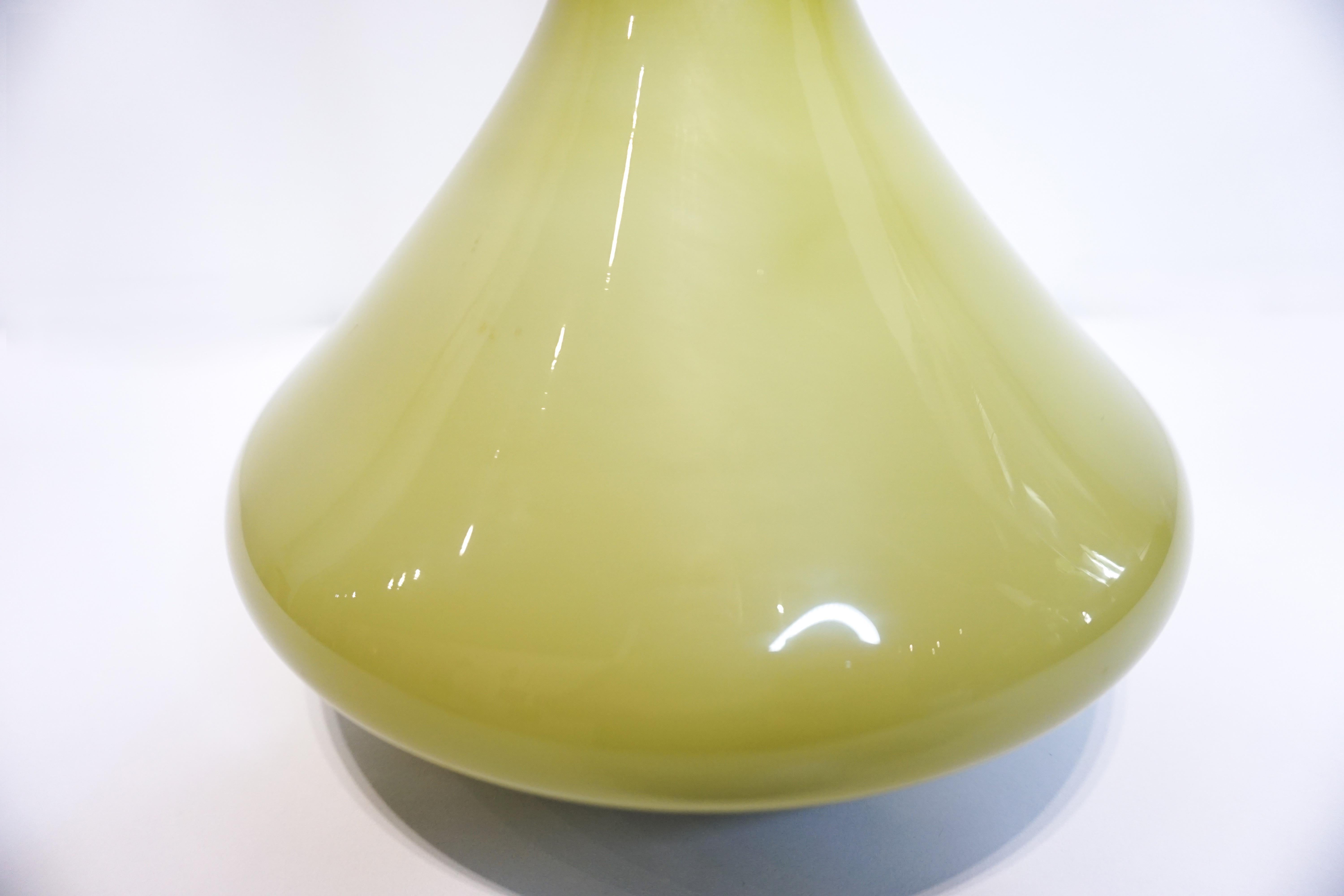 Pea green vintage murano glass vase will leave others envious. On a table, bedside, bookcase or as an occasional vase, this piece makes a lovely statement.