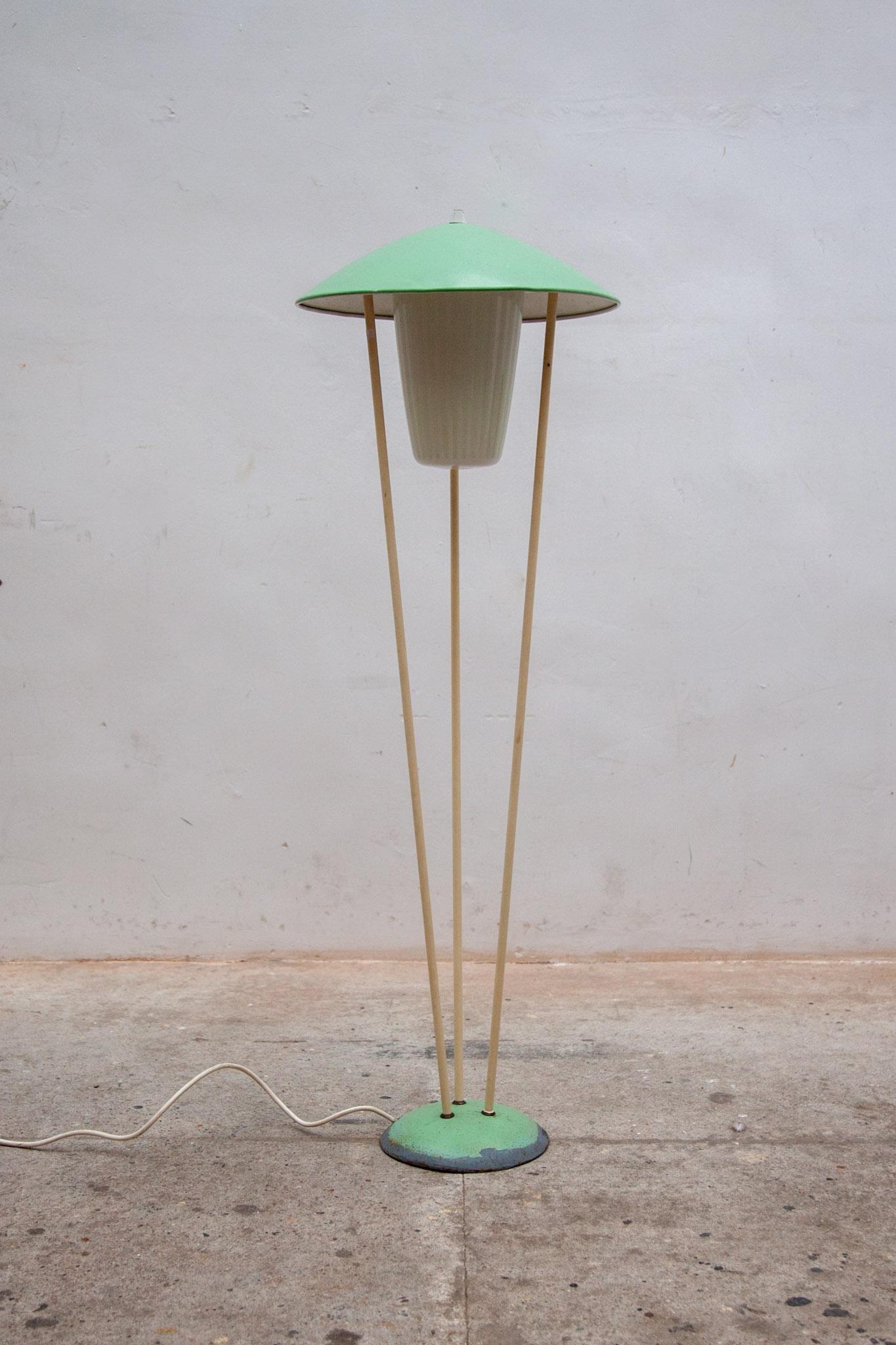 Floor-lamp 1958 by the BEGA brand that can be used both indoors and outdoors. These kind of lamp was popular to use at patio's, mini golf courses and other public places. The lamp is in beautiful vintage condition and the glass shade is still fully