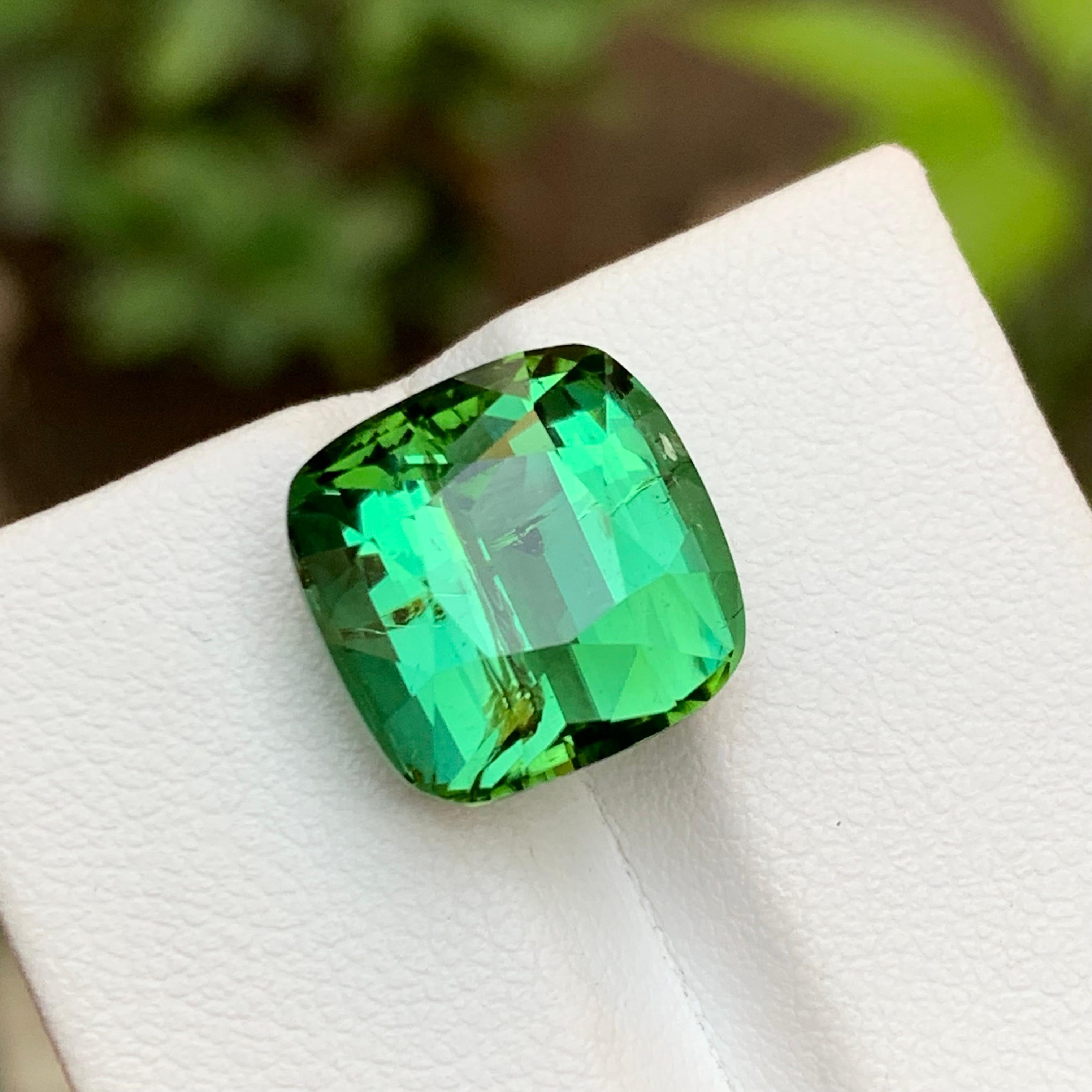 GEMSTONE TYPE: Natural Tourmaline 
PIECE(S): 1
WEIGHT: 10.90 Carats
SHAPE: Cushion Cut
SIZE (MM): 12.30 x 12.39 x 9.40
COLOR: Green
CLARITY: Moderately Included 
TREATMENT: None
ORIGIN: Afghanistan
CERTIFICATE: On demand
(if you require a