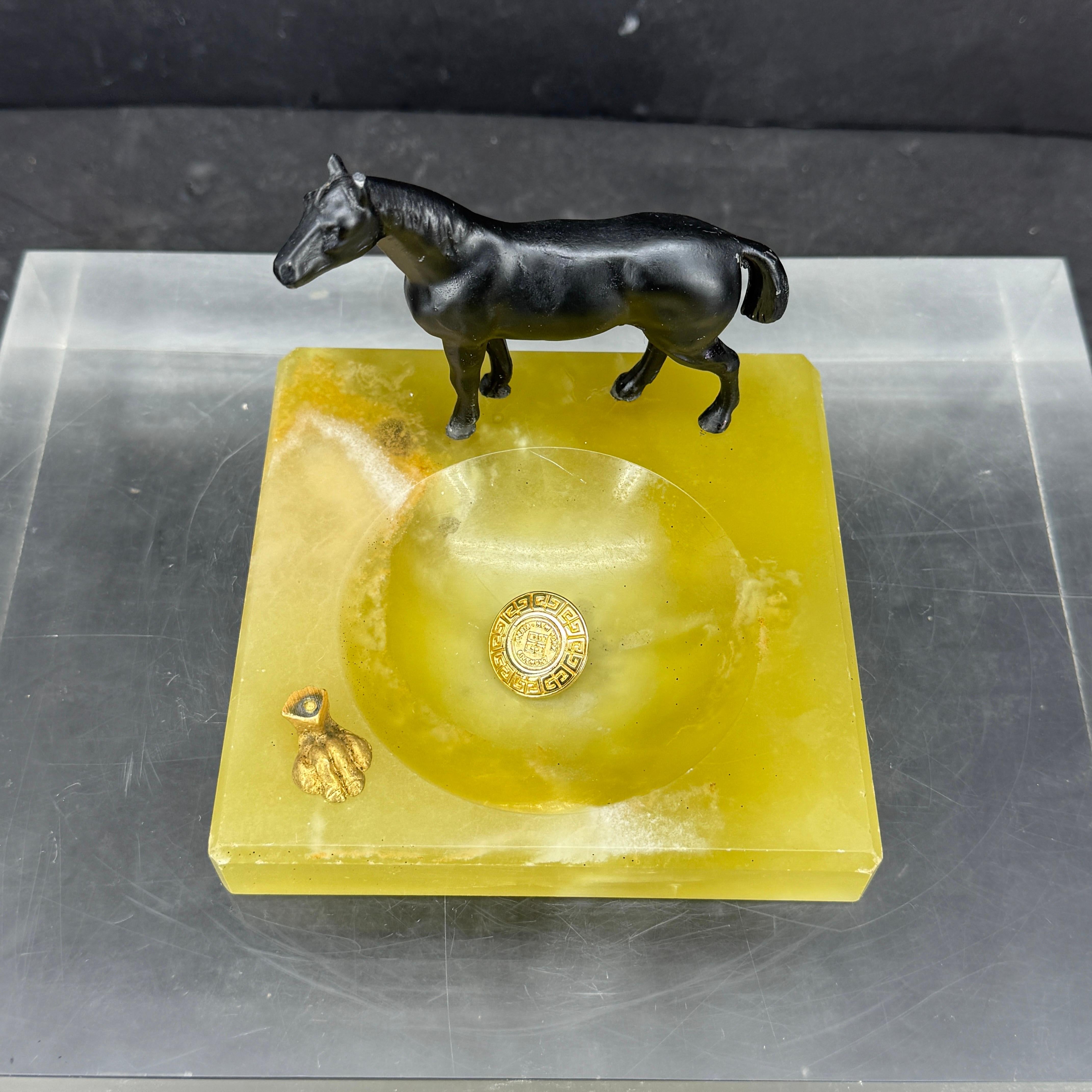 Oversized charming bronze horse statue on an onyx ashtray or jewelry tray. Very versatile piece that would look great as a display piece on a vanity or coffee table. 
 