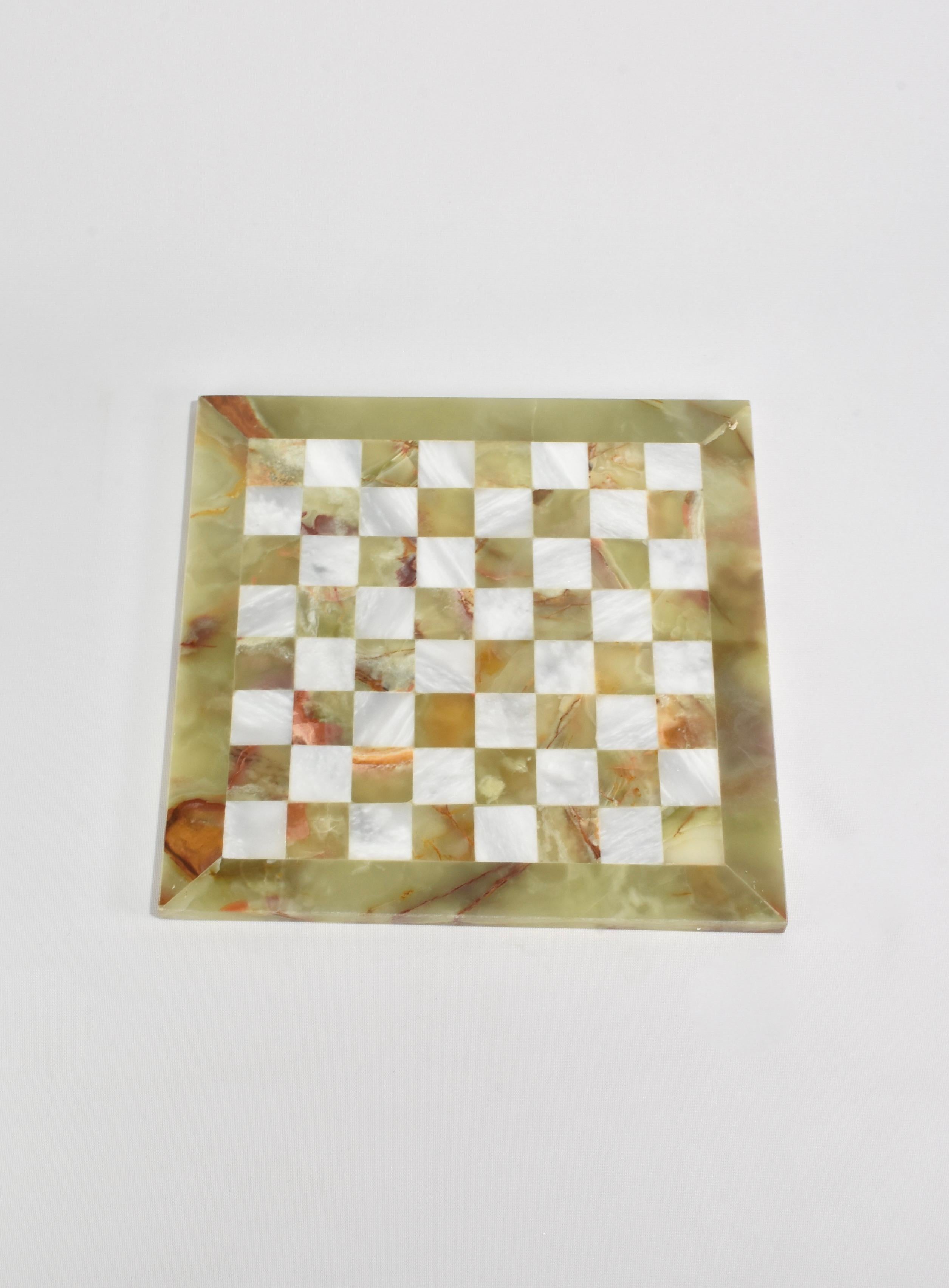Stunning, white marble and green onyx chess set with hand-carved pieces. Includes board and 32 pieces.

Please note: There are three chess sets available with slight variations in stone coloring. You will receive this one or a very similar