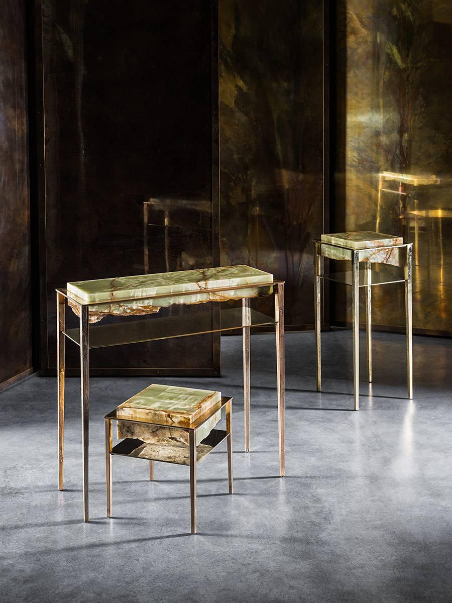 Each of these unique tables by acclaimed artist and master-craftsman, Gianluca Pacchioni, is handcrafted at the sculptor's studio in Milan. Liquid brass is poured onto raw slabs of green onyx travertine and suspended mid-air by uncannily thin legs.