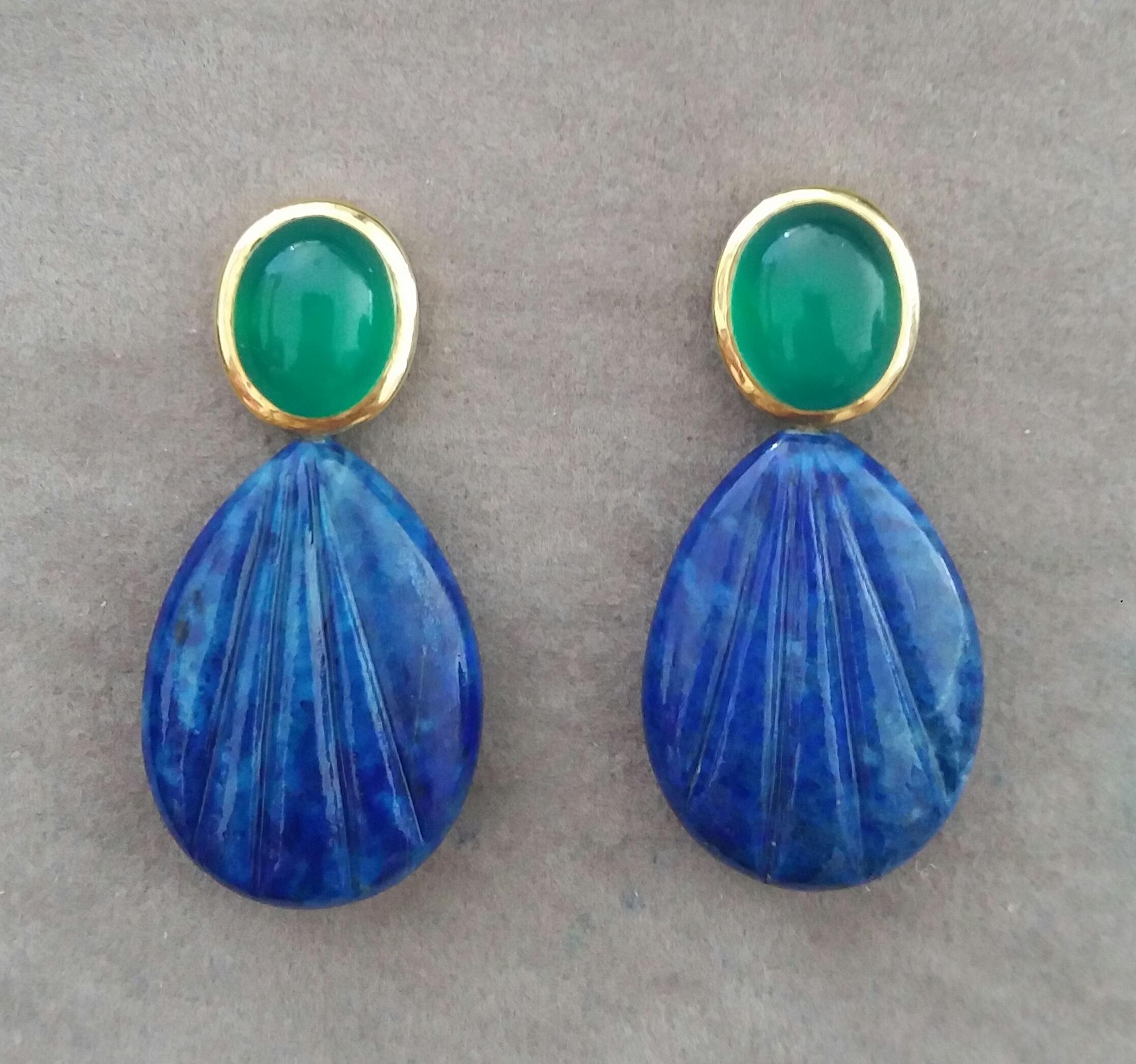 Elegant and completely handmade Earrings consisting of  upper parts of 2 oval shape Green Onyx Cabs measuring 9x11 mm set in a 14 Kt yellow gold bezel , in the lower part we have 2 Engraved Flat Drop Shape Natural Color Lapis Lazuli measuring 18x25 