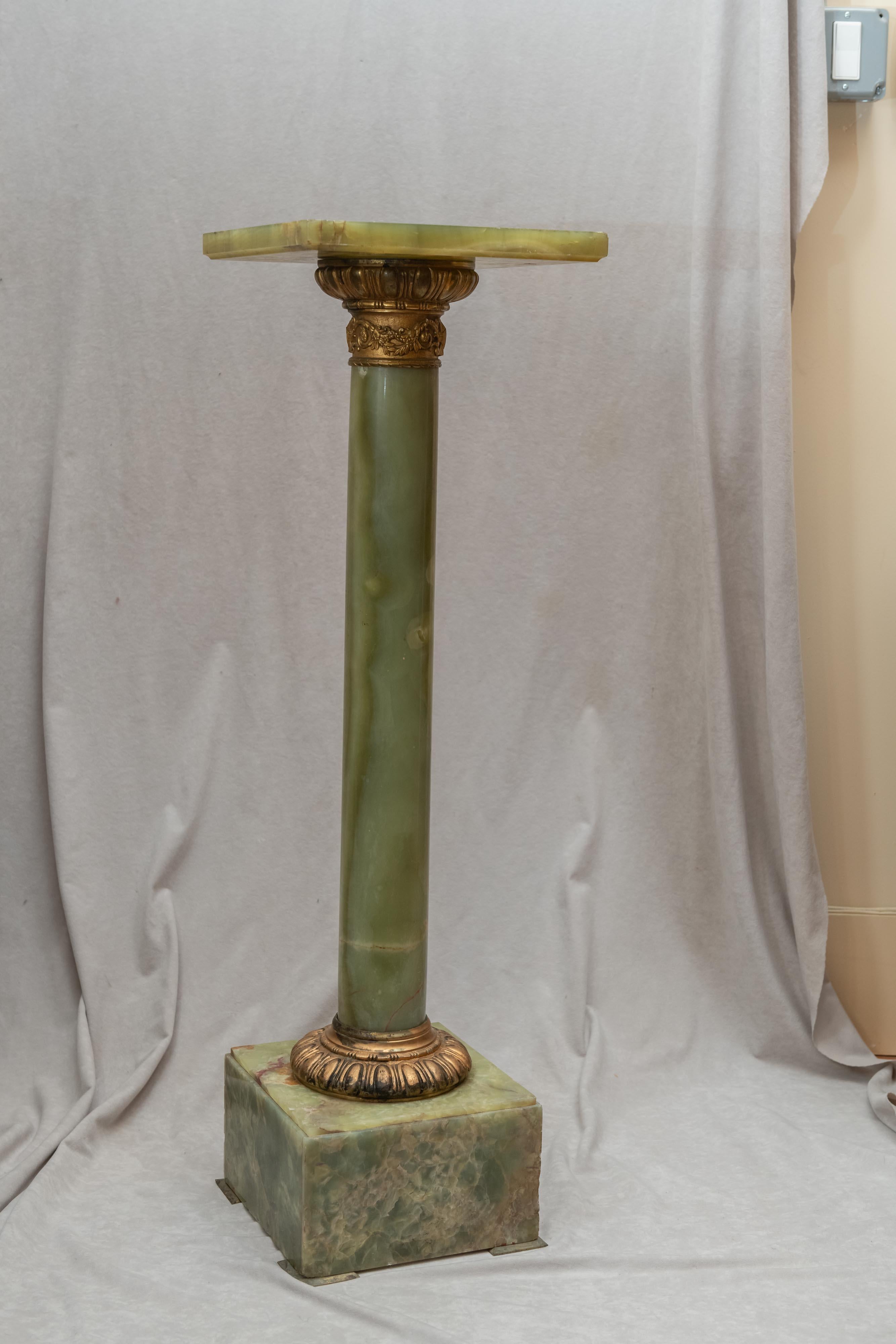 Colorful green onyx and rich gold ormolu make this a fine example of an antique pedestal. We believe it is Italian, circa 1900. If you are looking for a pedestal for a statue, vase, plant or whatever, this is a great option.