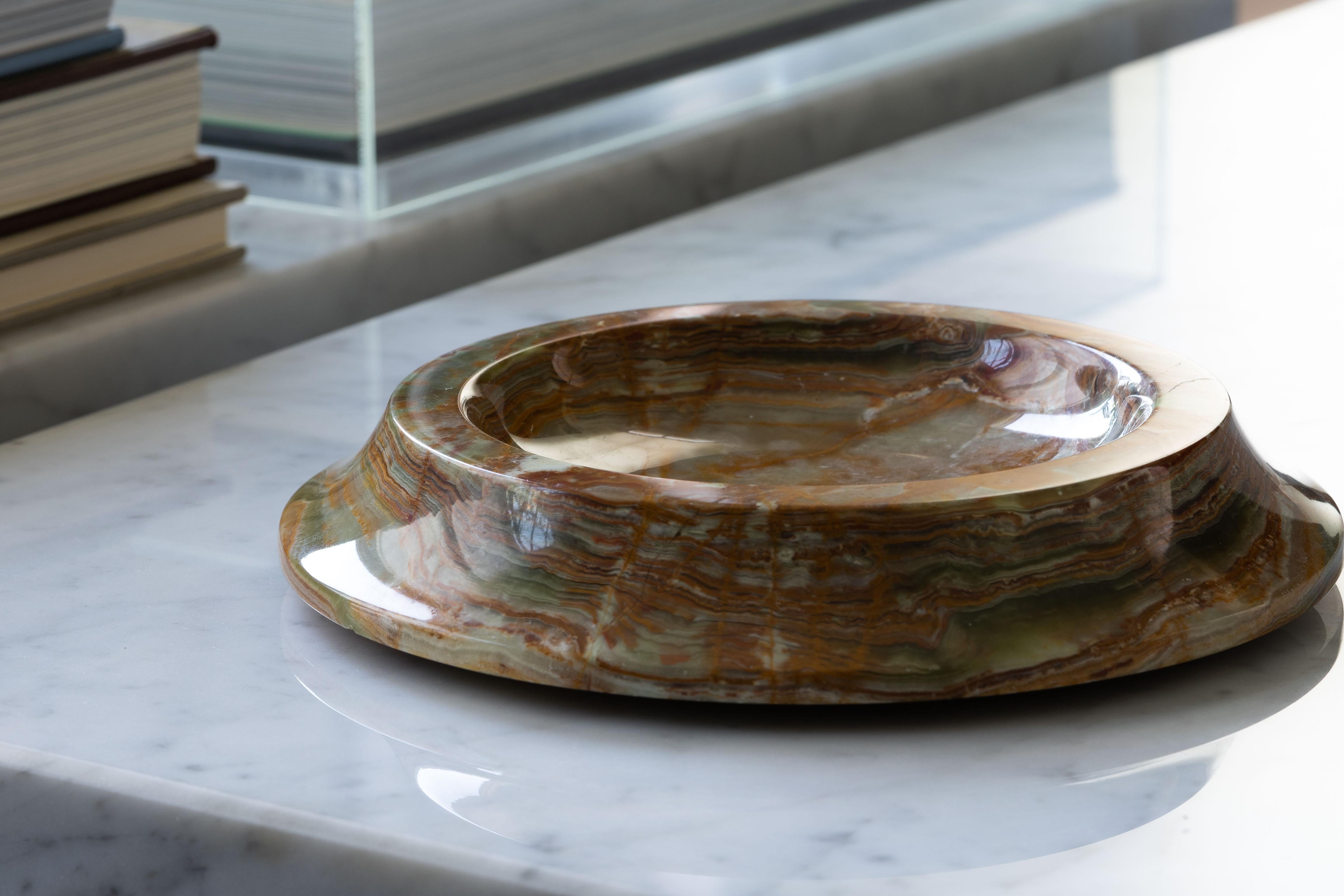A beautiful low scalloped dish attributed to Angelo Mangiarotti from 1970. After a visit to a marble quarry Mangiarotti was inspired to produce a series of onyx prototype objects of which this dish is most likely part. Carved from Green Bamboo Onyx,