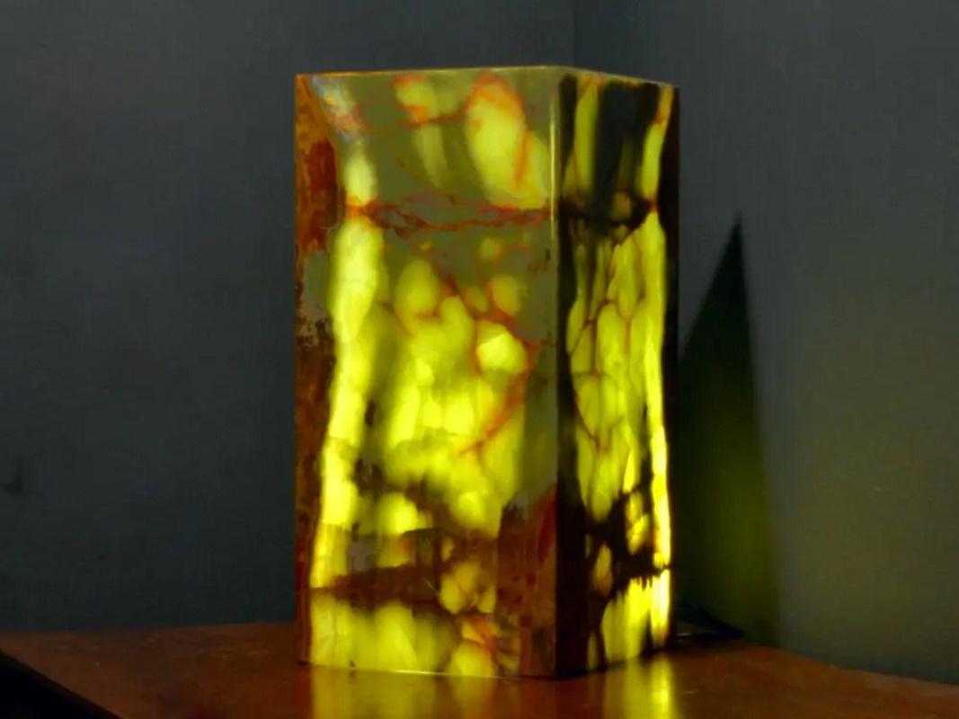 Square base ambient table lamp in onyx.