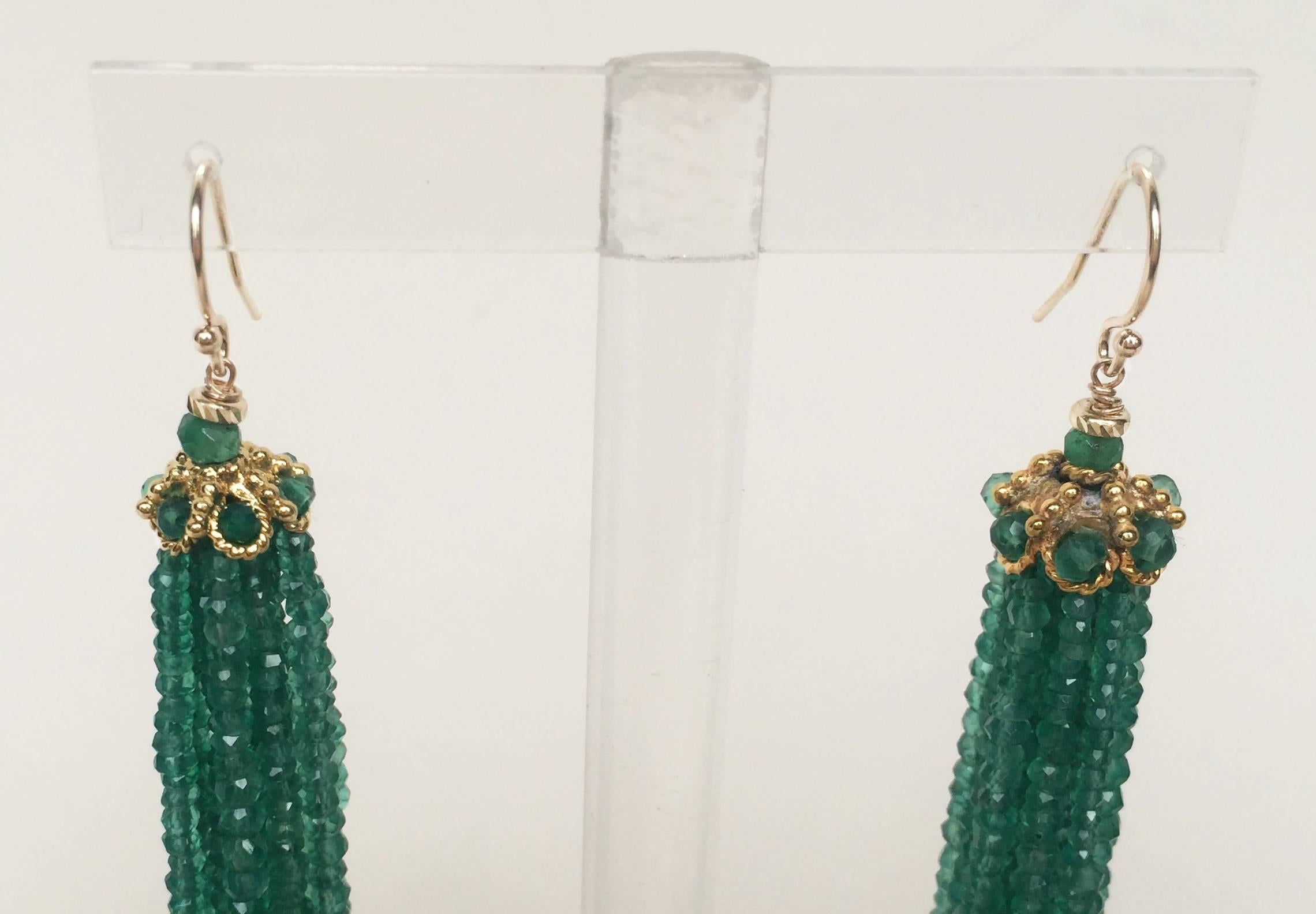 The vibrant green faceted onyx beaded tassel earrings (2.75 inches) flow beautifully. They frame the face well and make a statement with the shimmering  green tones. The 14k yellow gold cup with faceted green onyx beads crown the tassel with