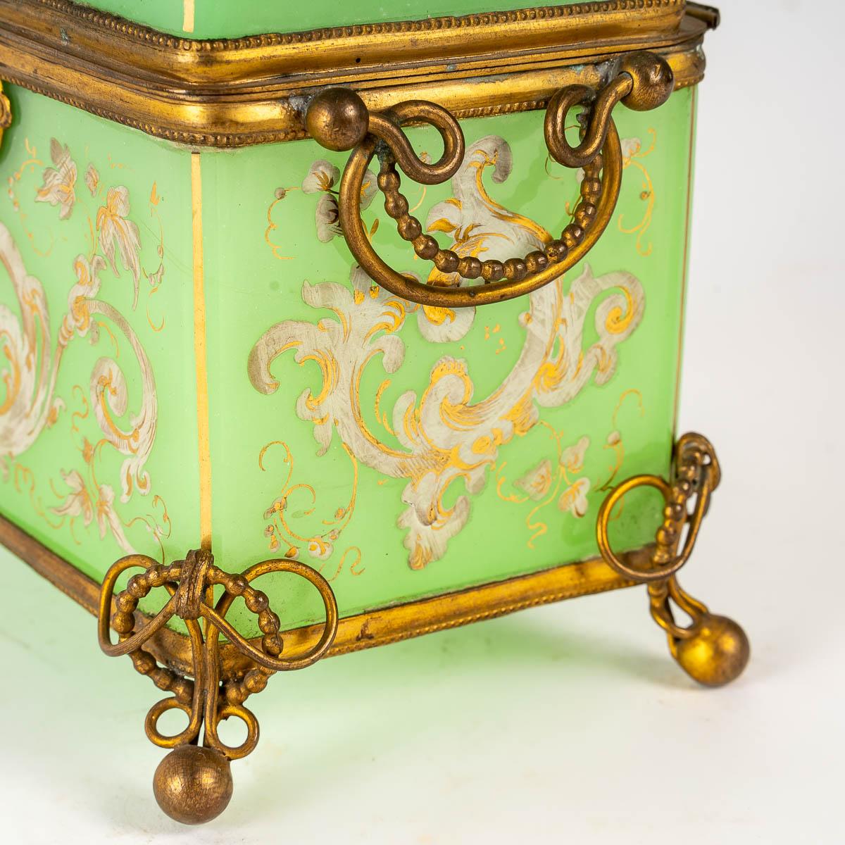 Green opaline box, 19th century.
Green opaline box, white enamel, Mid-19th Century, mounted with gilt brass.
Measures: H: 12.5 cm, W: 14 cm, D: 10 cm.
 