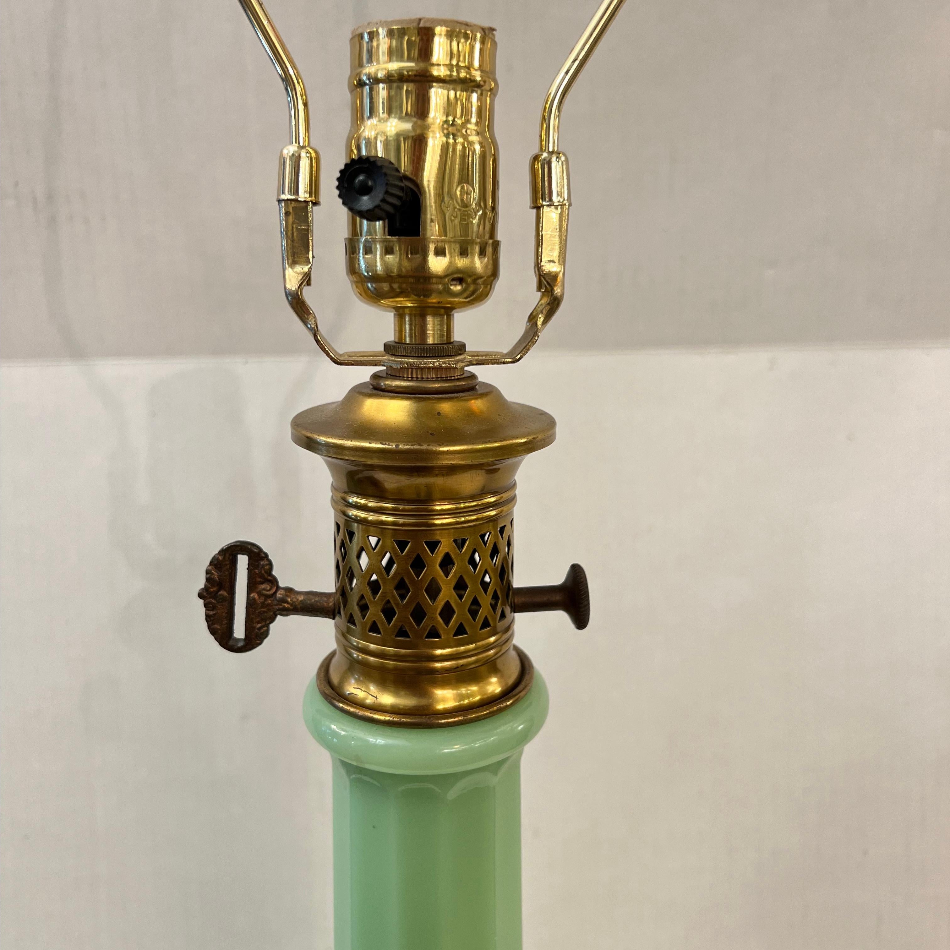 A circa 1930's French opaline glass table lamp with gilt hardware.

Measurements:
Height of body: 24.5