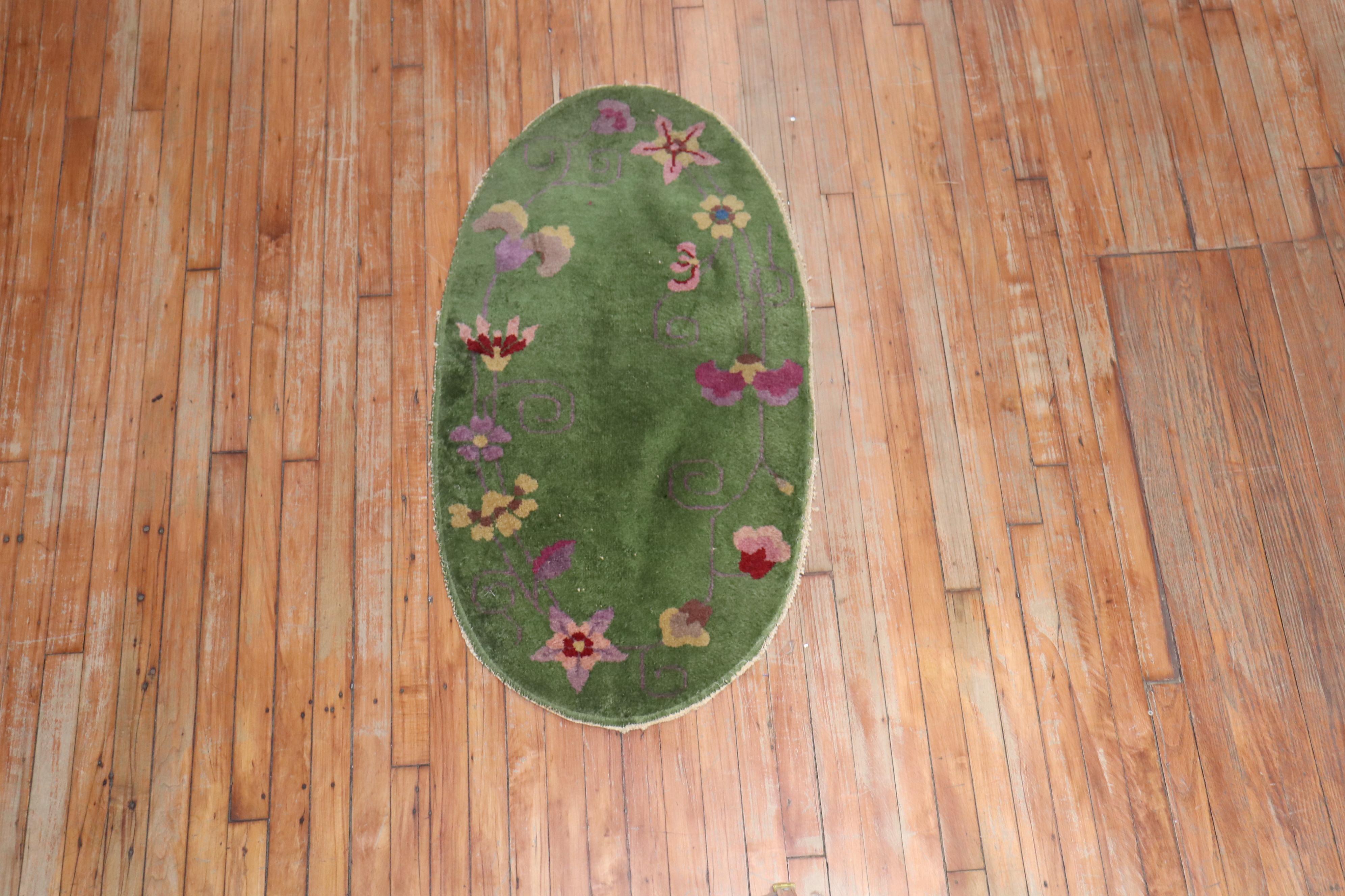 Rare oval-shaped Green Chinese Art Deco rug.

Measures: 2' x 3'10''

Chinese Art Deco rugs are known for their striking mix of asymmetrical patterns, vibrant colors, and traditional motifs, which are is bold, beautiful, and quite rare. Woven