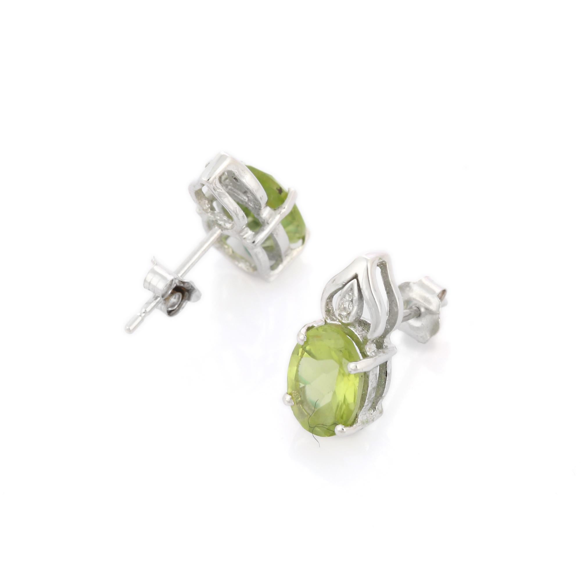 Art Deco Green Oval Peridot Gemstone Stud Earrings with Diamonds in 14K White Gold  For Sale