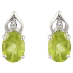 Green Oval Peridot Gemstone Stud Earrings with Diamonds in 14K White Gold 