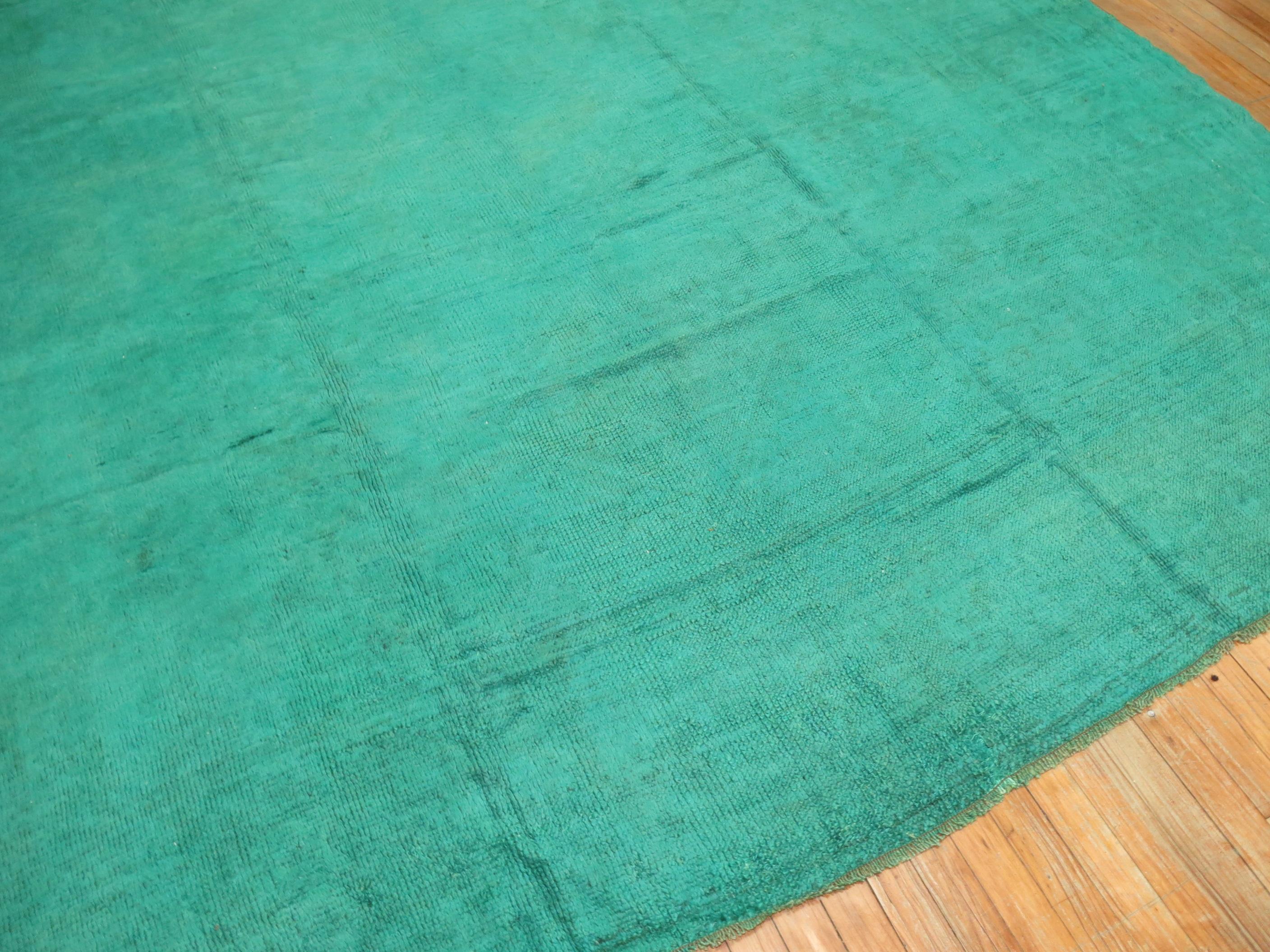 Antique square Angora wool Oushak rug that has been over-dyed in emerald green to give it a beautiful, subdued, and ethereal look. The rug has a chunkier pile and can easily handle heavy everyday traffic.

9' x 9'3''