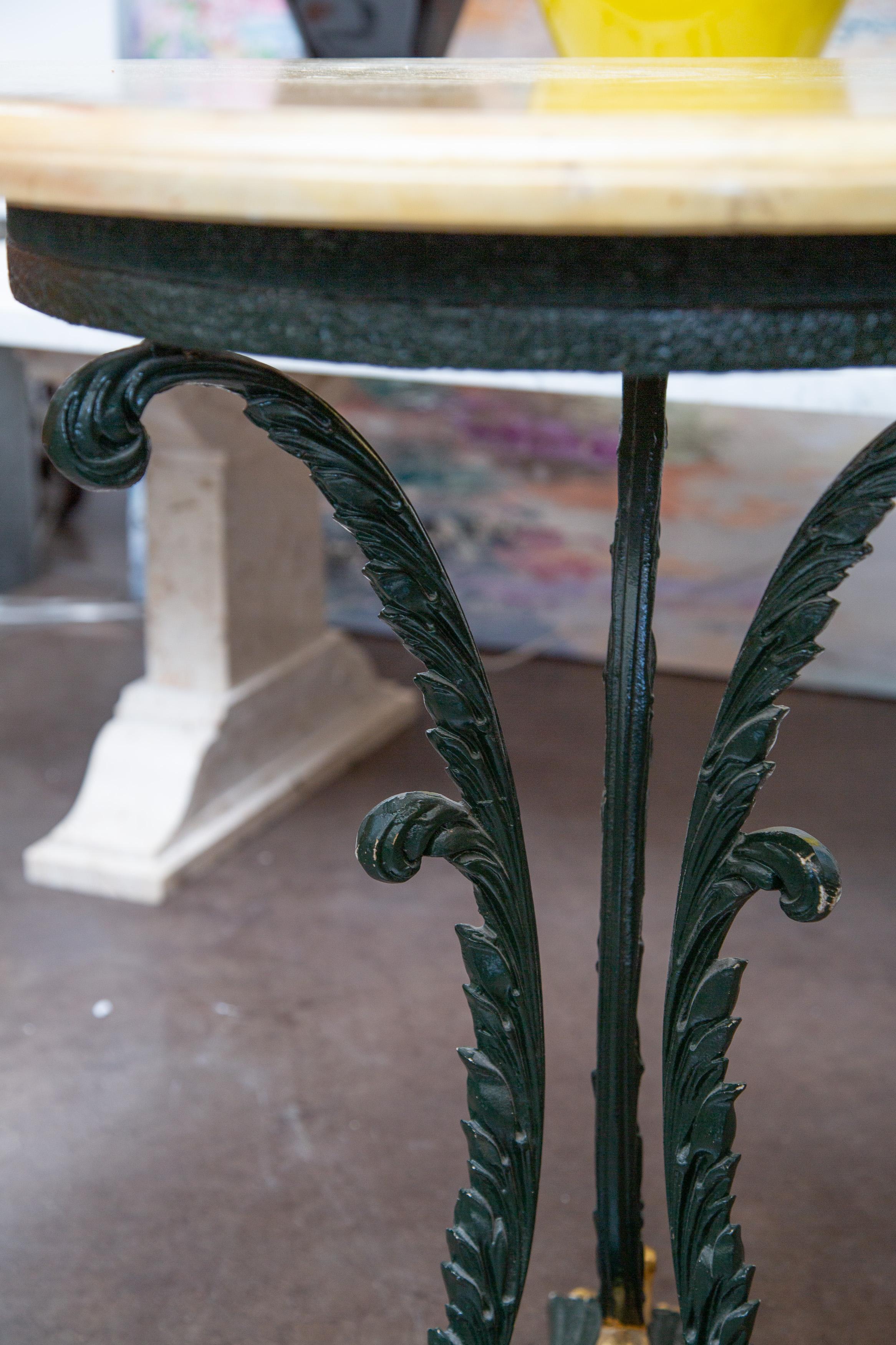 Green Painted and Parcel Gilt Iron Circular Table with Travertine Top In Good Condition For Sale In WEST PALM BEACH, FL