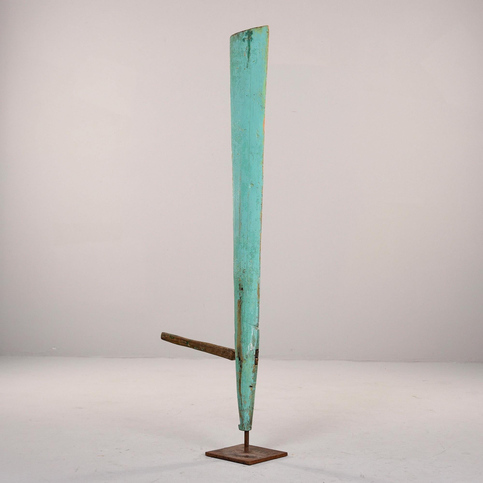 Found in England, this circa 1900 wooden boat rudder is mounted on an iron display stand. Rudder found painted as shown - we do not know if the green paint is original. Very good overall antique condition with surface wear and patina to painted