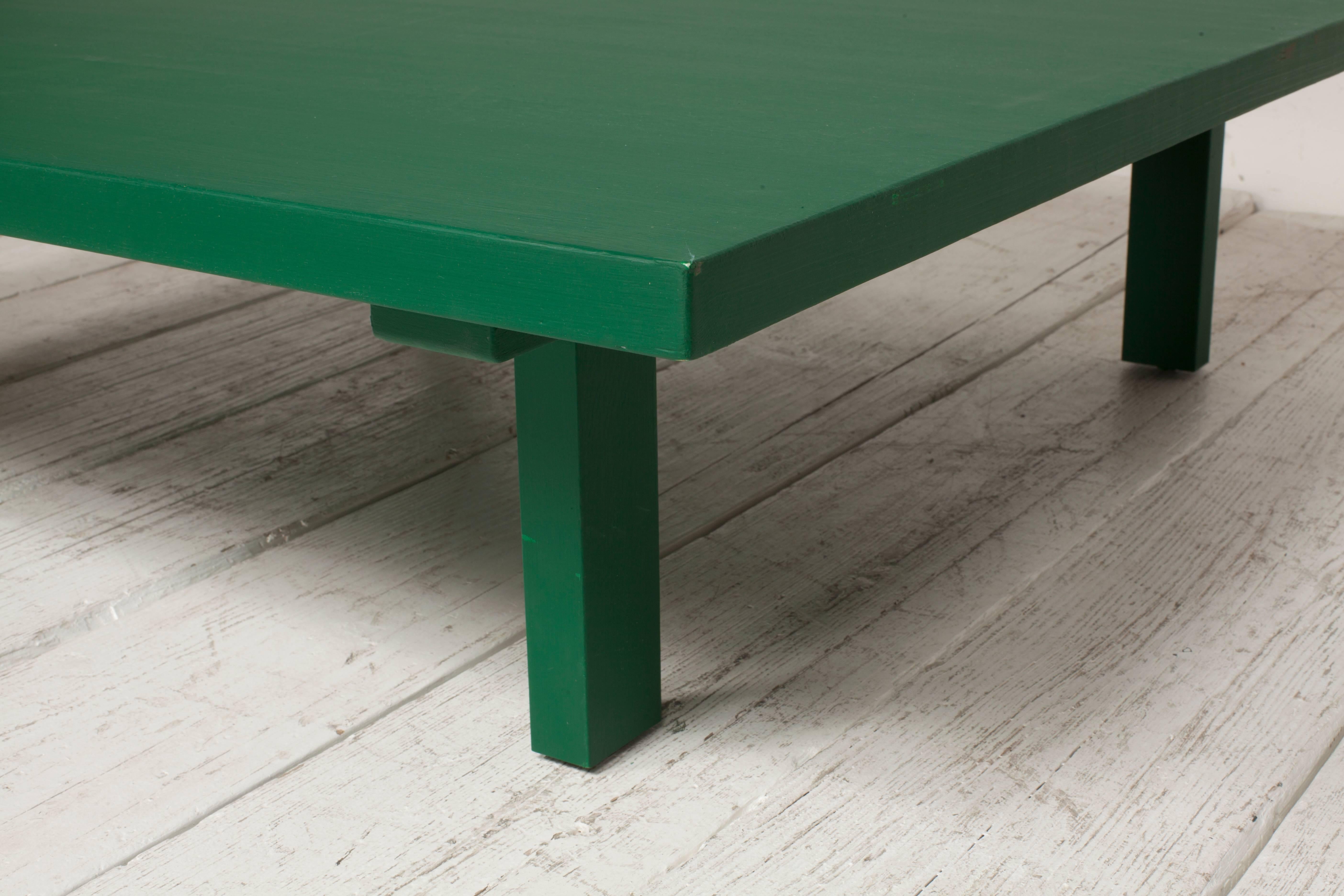 Green painted paine square coffee table with four simple legs.