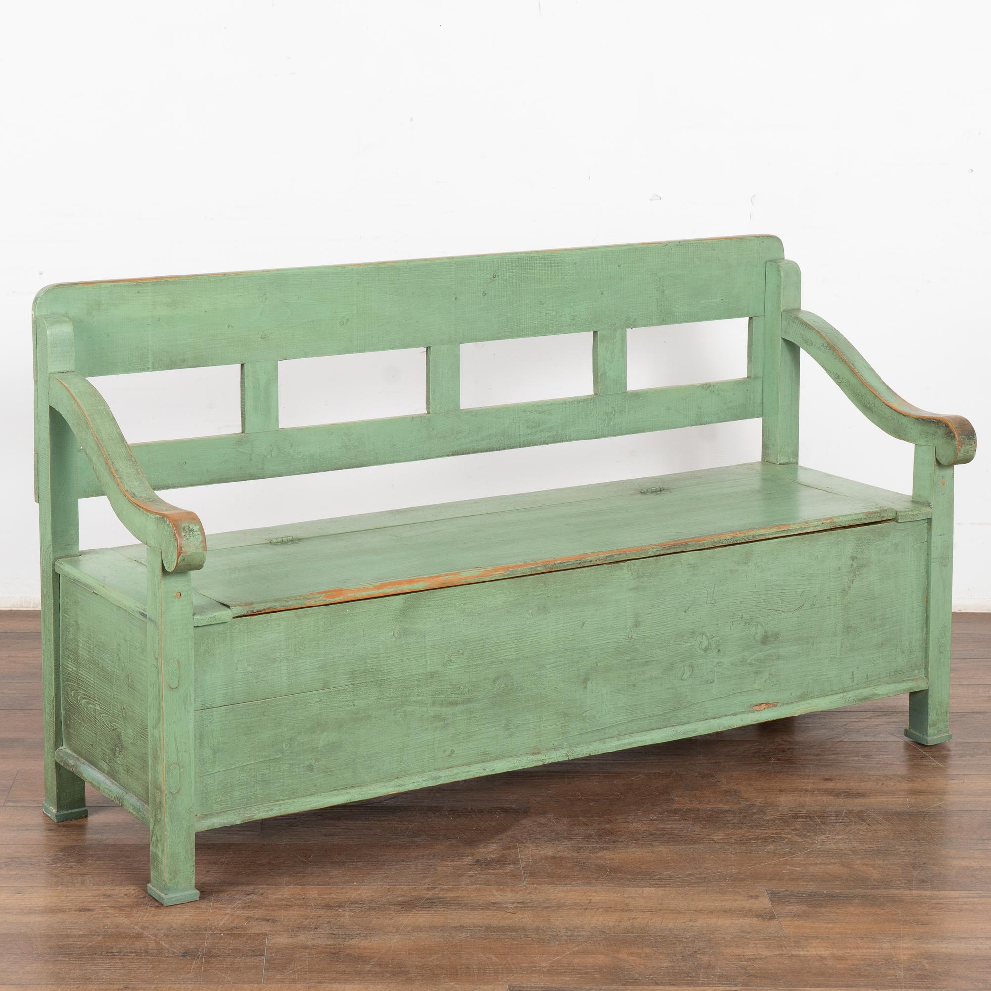 This delightful pine bench reminds one of a warm summer day in the European countryside.
The green paint was added later and has been naturally worn and distressed in areas revealing the natural pine below, all adding to the character and of the