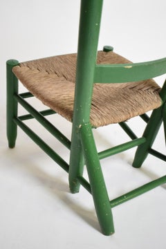 Green painted wood and straw fireside chair, 1960s.