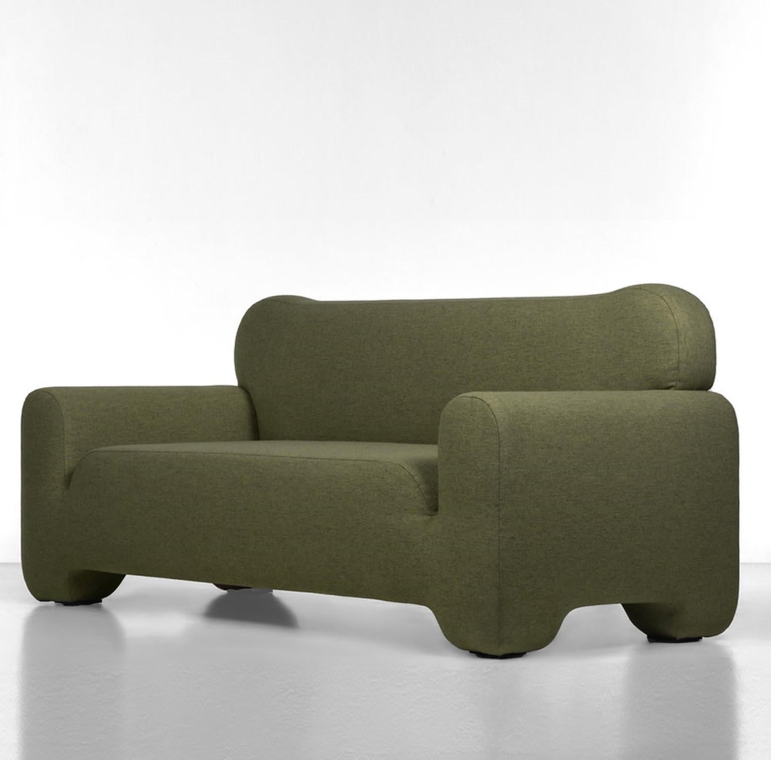 Green Pampukh sofa by Faina
Design: Victoriya Yakusha
Materials: Textile, foam rubber, sintepon, wood
Dimensions: W 240 x D 82 x H 79 cm

Unusual convex lines of the PAMPUKH series are ideally combined with its volumetric silhouette. PAMPUKH seems