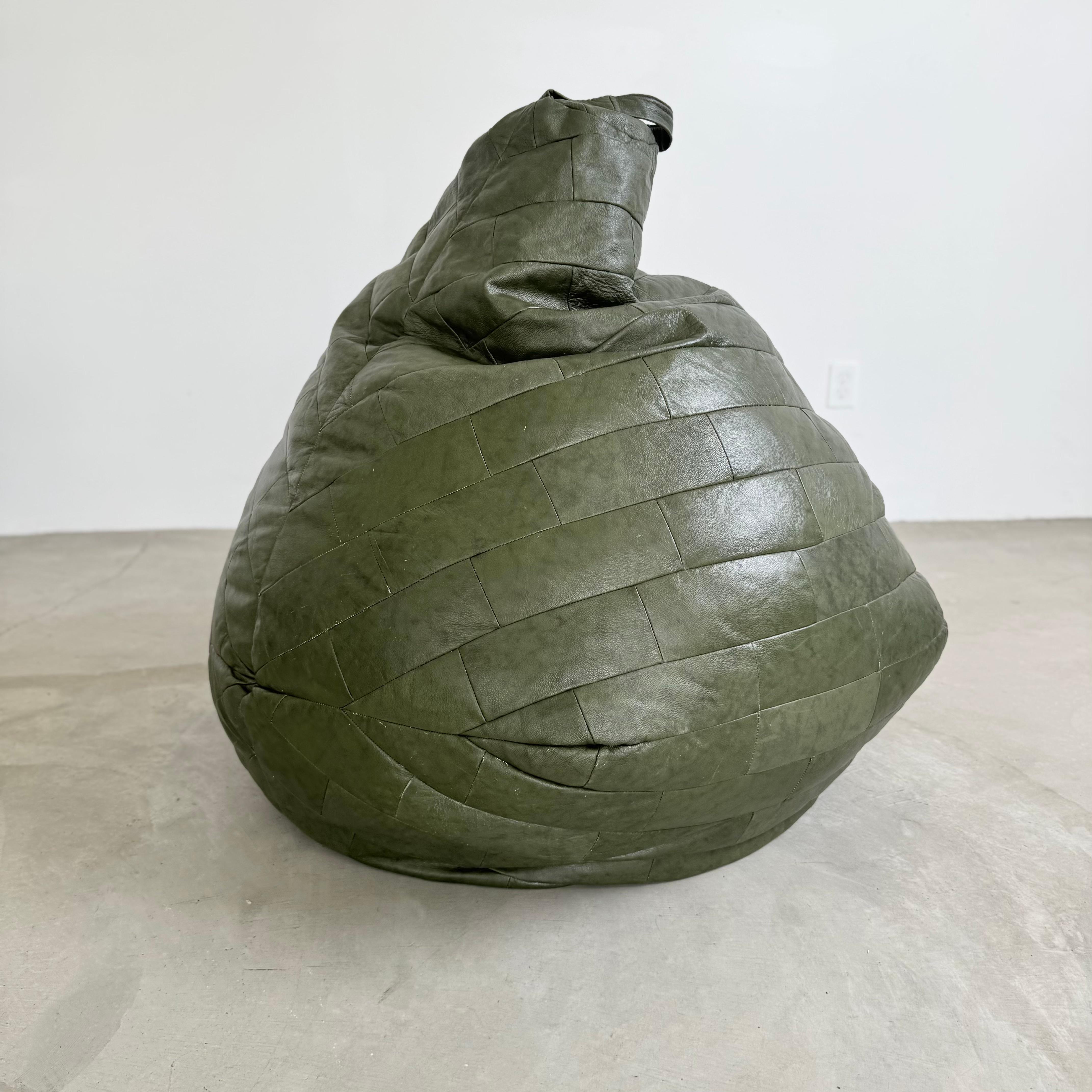 Beautiful Green leather patchwork beanbag manufactured by Swiss company De Sede in the 1970s. Stunning coloring and patina on this leather that only gets better with time.

Leather is textured and soft, giving it life and personality. Extremely