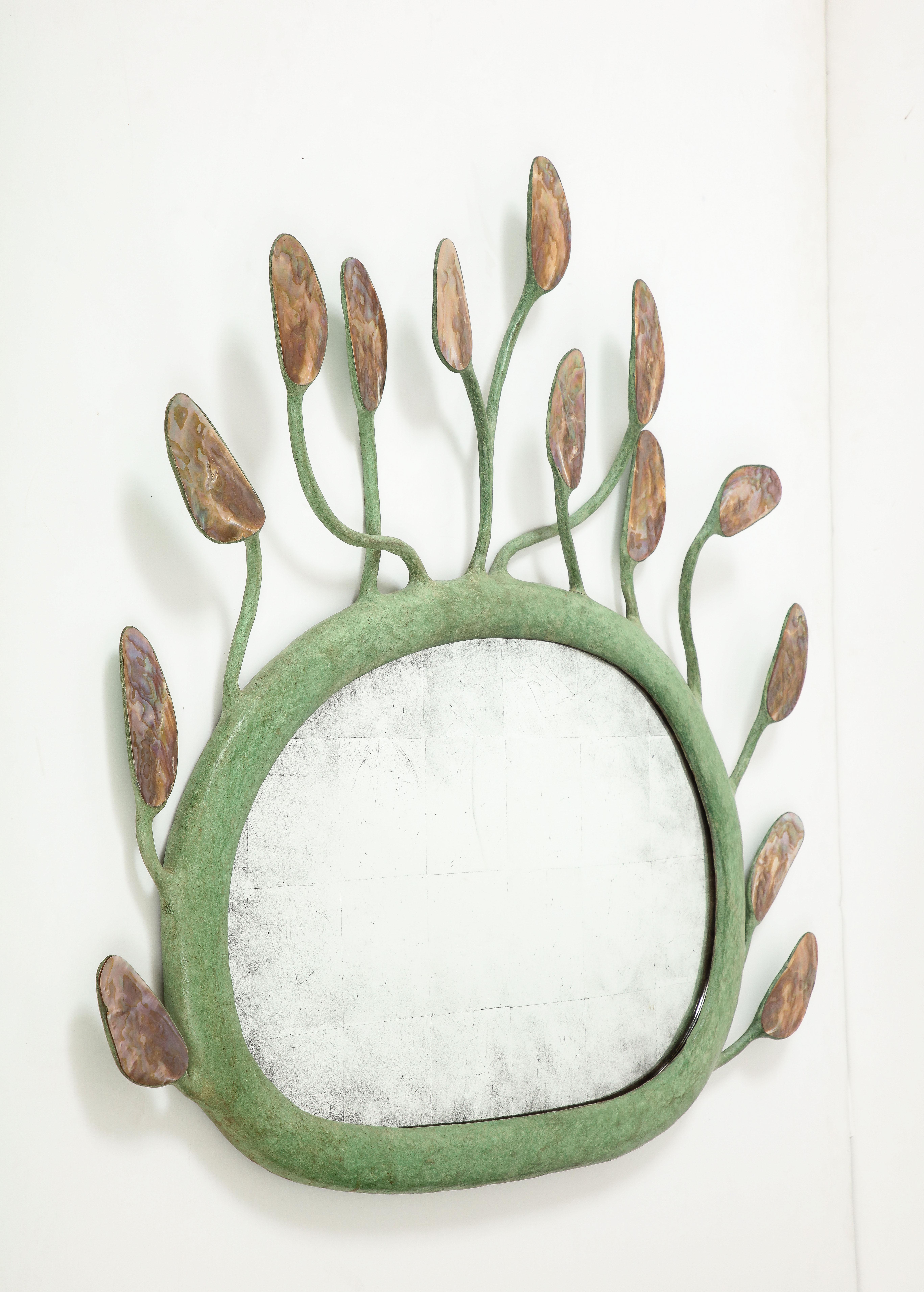 Green patinated resin and mother of pearl inlay sculptural mirror in the manner of Garouste & Bonetti.