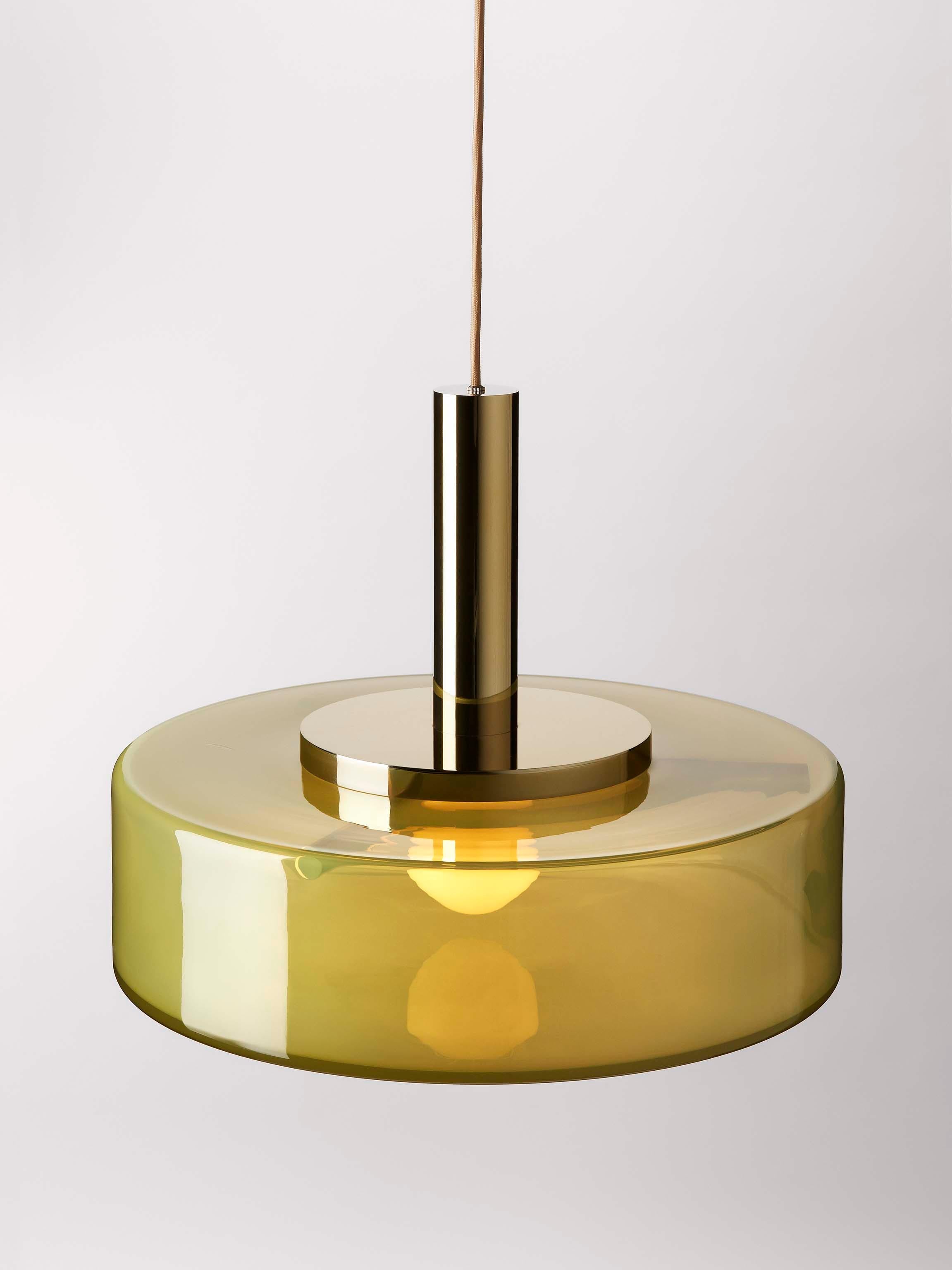 Green pendant light by Dechem Studio
Dimensions: D 56 x H 180 cm
Materials: Brass, glass.
Also available: different colours and sizes available

Named after the series of successful Czechoslovak science satellites that orbited the Earth in the